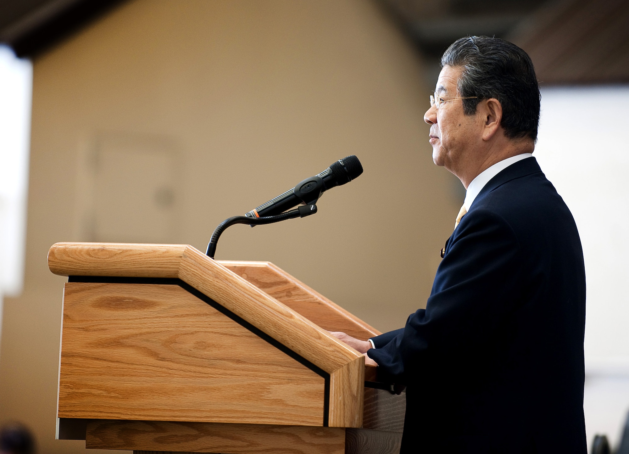 YOKOTA AIR BASE, Japan -- Toshimi Kitazawa, Japan Minister of Defense, speaks at Hangar 15 here April 23, 2011. Minister Kitazawa visited Yokota Air Base to thank U.S. service members for their efforts in support of Operation Tomodachi and to observe a bilateral demonstration of the U.S. Marine's and Japan Ground Self Defense Force's chemical response forces. (U.S. Air Force photo/Staff Sgt. Chad C. Strohmeyer)
