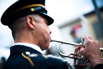 YOKOTA AIR BASE, Japan -- A band member plays at Hangar 15 here April 23.  Band members played prior to and during the visit of Toshimi Kitazawa, Japan Minister of Defense, who was here to observe a bilateral demonstration of U.S. Marine and Japan Ground Self Defense Force chemical response forces. (U.S. Air Force photo/Staff Sgt. Chad C. Strohmeyer)
