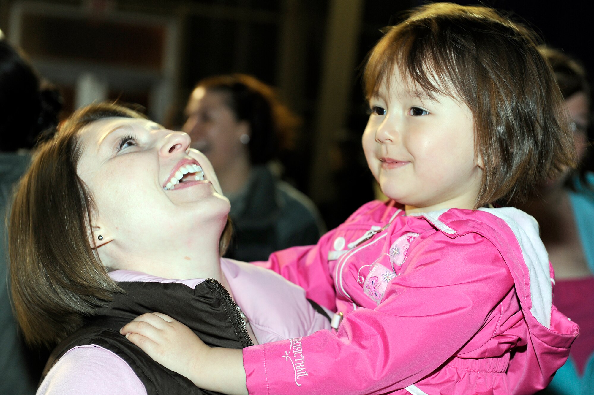 MISAWA AIR BASE, Japan -- Capt. Brandi Rountree, 35th Fighter Wing sexual assault response coordinator, holds her daughter Mikaia Rountree 22 April.  During a one-week period following the 11 March earthquake in Japan, more than 1,300 family members travelled to locations in the U.S. on one of six chartered flights that departed Misawa as part of the Department of State-authorized voluntary departure program. (U.S. Air Force photo by Staff Sgt. Marie Brown\Released)