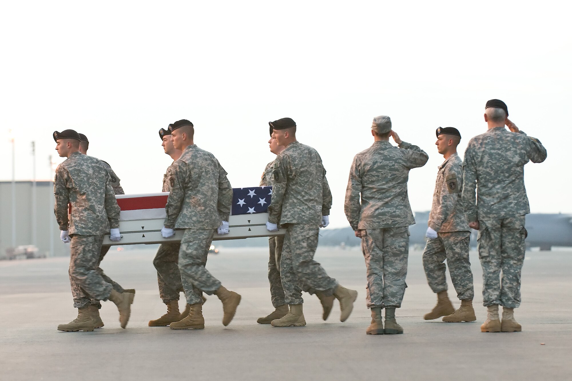 A U.S. Army carry team transfers the remains of Army Sgt. John P. Castro, of Andrews, Texas, at Dover Air Force Base, Del., April 23, 2011. Castro was assigned to the 1st Battalion, 506th Infantry Regiment, 4th Brigade Combat Team, 101st Airborne Division (Air Assault), Fort Campbell, Ky. (U.S. Air Force photo/Roland Balik)