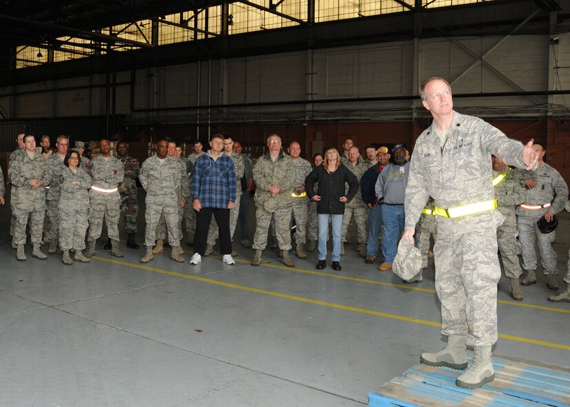 Chaplain Lt. Colonel Scott Doby addresses members of the 131st Bomb Wing during a safety brief in Hanger 1 on the north side of the base, April 25.  "There are a lot of memories and emotions attached to this place," said Doby, "but we need to slow down.  Now is the time to lean upon each other.  We can keep on keepin' on."   A category EF2 tornado hit Lambert-Saint Louis International Airport and swept across the 131st Bomb Wing Missouri Air National Guard Base, April 22.  No injuries were reported to Air National Guard personnel, but there was widespread damage across the south side of the base.  Cleanup efforts at the base are ongoing. (Photo by Master Sgt. Mary-Dale Amison)