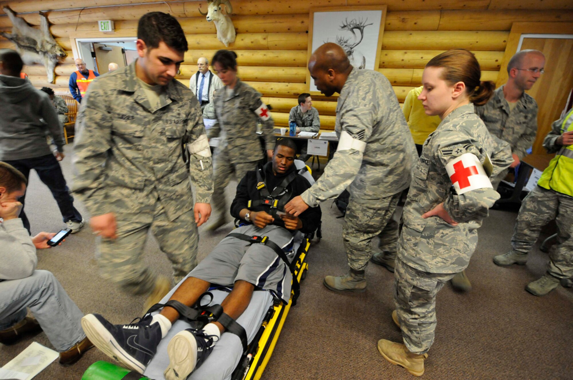 JBER medical personnel assist a simulated casualty during the NEO phase of Polar Force 11-4. (U.S. Air Force photo/Steve White)