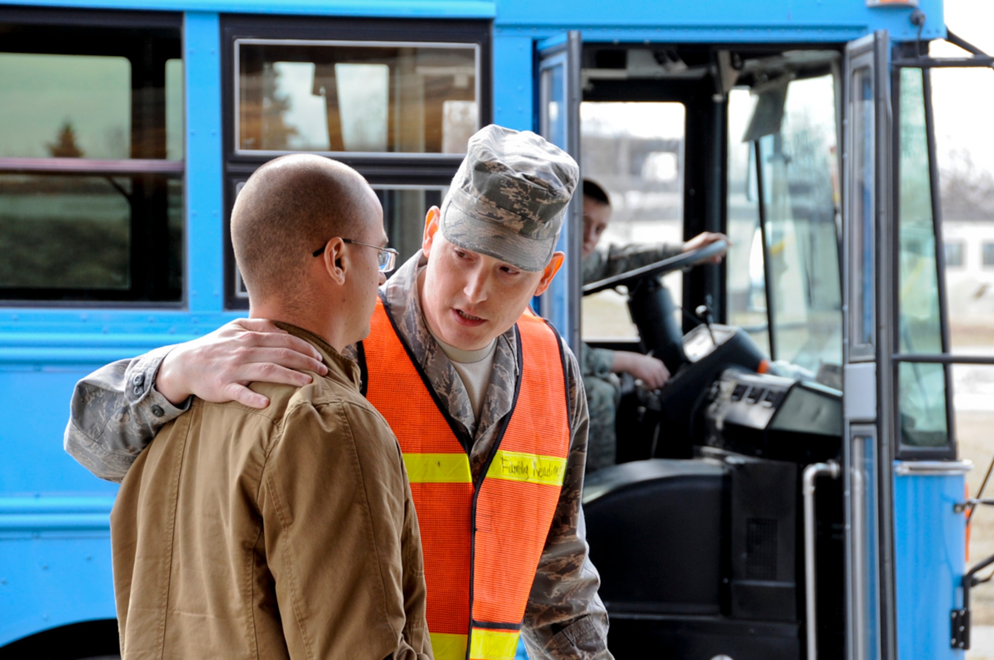 Air Force Master Sgt. Adam Dunny, 673d Force Support Squadron listems to distraught role player Airman 1st Class Marcus Signer, 673d Security Forces Squadron, during the noncombatant evacuation operation phase of Polar Force 11-4 exercise at Joint Base Elmendorf-Richardson April 14–16. (U.S. Air Force photo/Steve White)