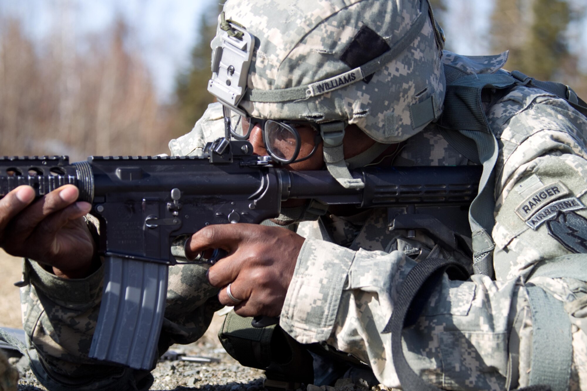 Sgt. Jonathan Williams, 1st Battalion (Airborne), 501st Infantry Regiment, fires his M-4 Carbine, April 13, at the Joint Base Elmendorf-Richardson range during the U.S. Army Alaska Warrior Challenge Competition. The competition decided Williams as USARAK Noncommissioned Officer of the Year and Spc. James Wells, 95th Chemical Company, as Soldier of the Year. (U.S, Army photo/Staff Sgt. Brehl Garza)