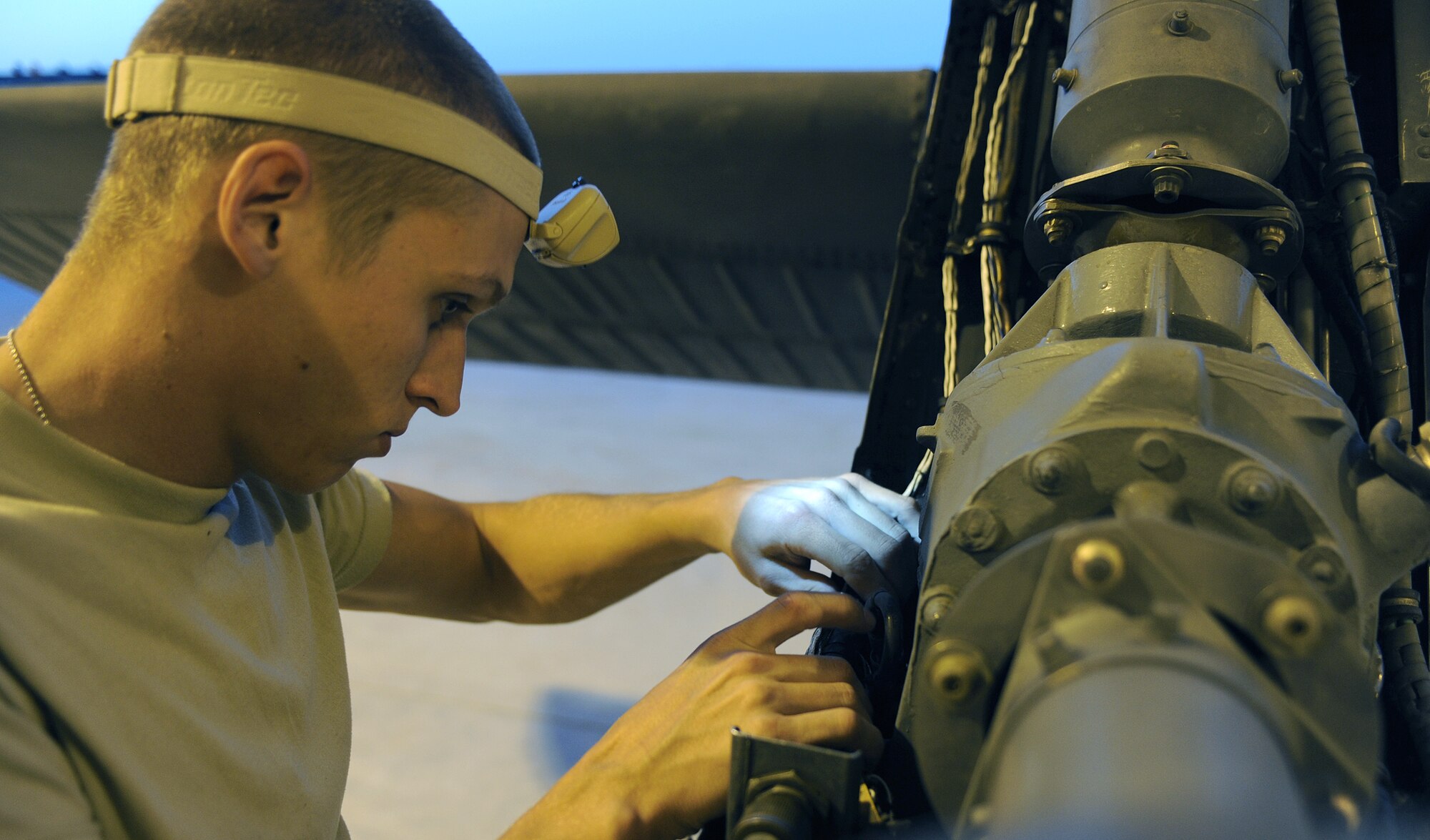 Airman 1st Class Anthony Phillipp inspects the tail of an HH-60 Pave Hawk April 18, 2011, at Kandahar Airfield, Afghanistan. The inspection was part of a 300-hour routine analysis of the aircraft. Airman Phillipp is a crew chief assigned to the 55th Expeditionary Helicopter Maintenance Unit. (U.S. Air Force photo/Senior Airman Willard E. Grande II)