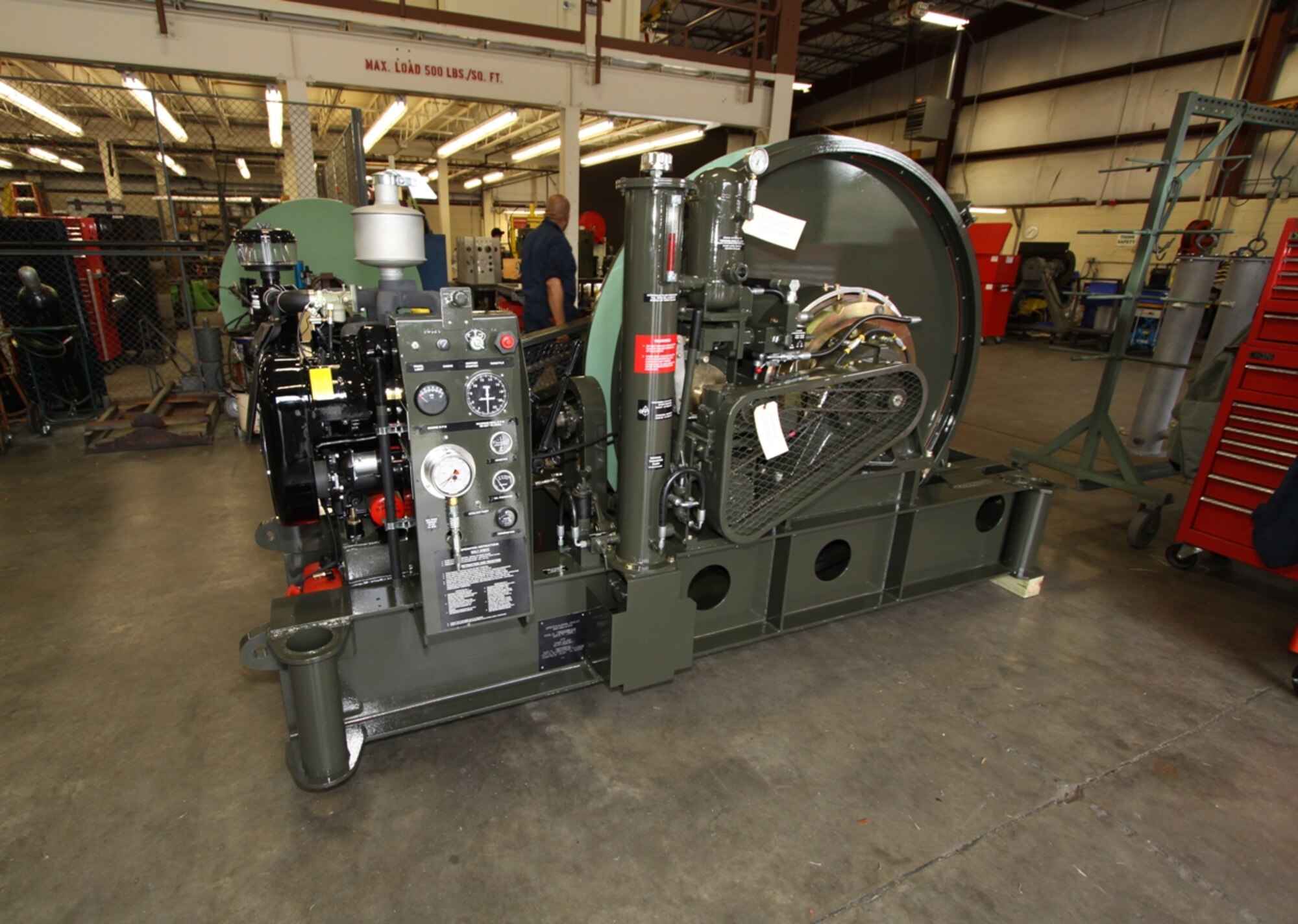 A rebuilt aircraft arresting system BAK-12 absorber unit stands ready for shipment back to an Air Force base. Technicians at the Civil Engineer Maintenance Inspection and Repair Team, or CEMIRT, located at Tyndall Air Force Base, Fla., overhaul an average of 36 arresting systems a year. (U.S. Air Force photo/Eddie Green)