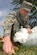 Staff Sgt. James Brown, 10th Intelligence Squadron systems planner, throws 
away debris in a field at Langley Air Force Base, Va., April 22, 2011. Langley
personnel participated in base clean-up during Earth Week, April 18-22. 
(U.S. Air Force photo by Staff Sgt. Jeff Nevison/Released)
