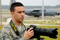 Air Force Reserve Tech. Sgt. Samuel King Jr. lines up a shot during a recent photographic assignment at Duke Field, Fla.  The photojournalist, assigned to the 919th Special Operations Wing public affairs office, landed 10 first-place awards in two different commands before placing twice in the 2010 Air Force-wide media contest.   (U.S. Air Force photo/Adam Duckworth)