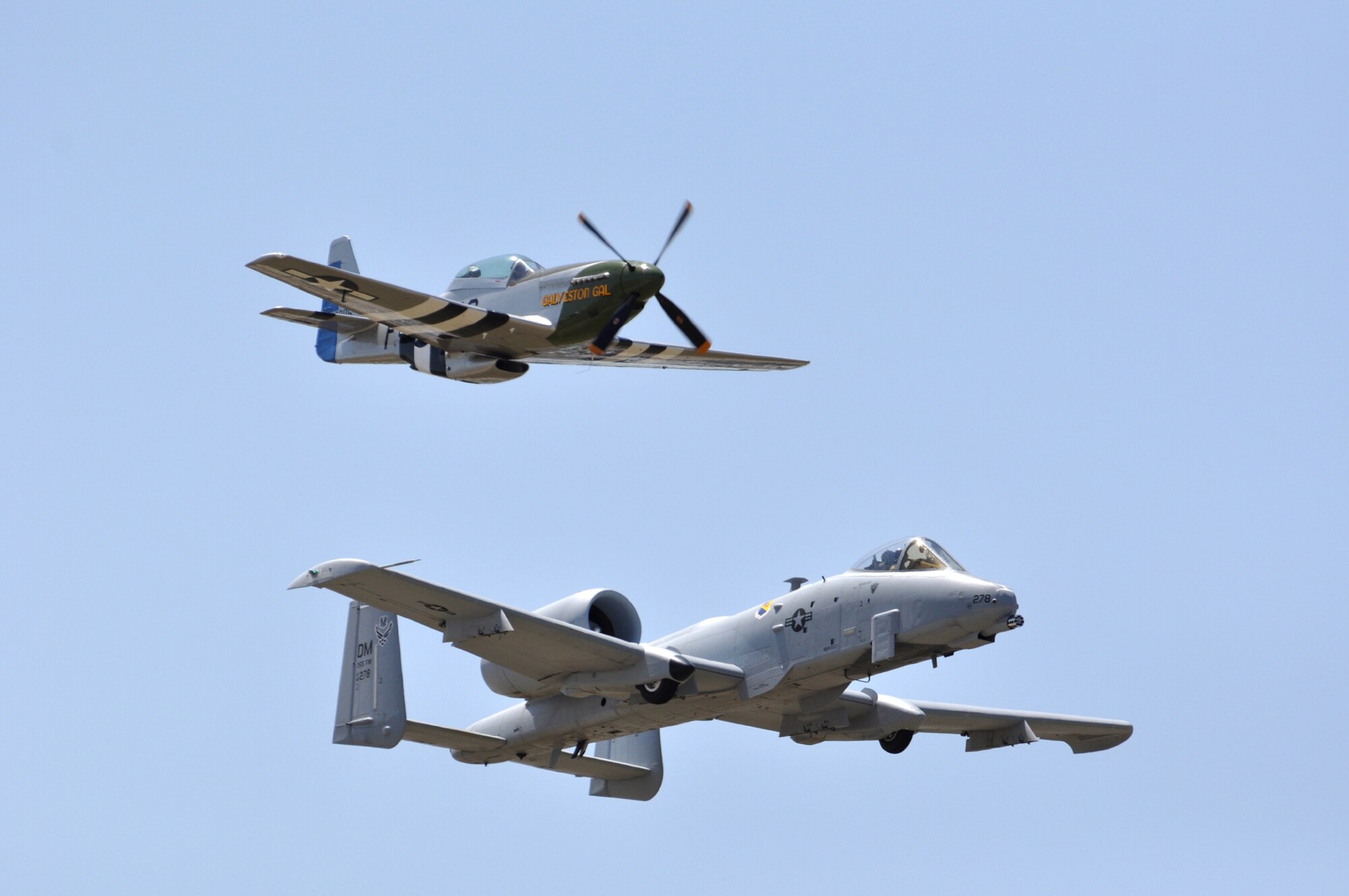 A P-51 Mustang and A-10 Thunderbolt II fly a heritage formation over the Naval Air Station Fort Worth JRB, Texas, Air Expo 2011 April 16.  The base played host to more than 100,000 people on the first day of the two-day air show and open house.  The U.S. Navy Blue Angels flight demonstration team headlined the event.  (U.S. Air Force photo/Lt. Col. David Kurle)