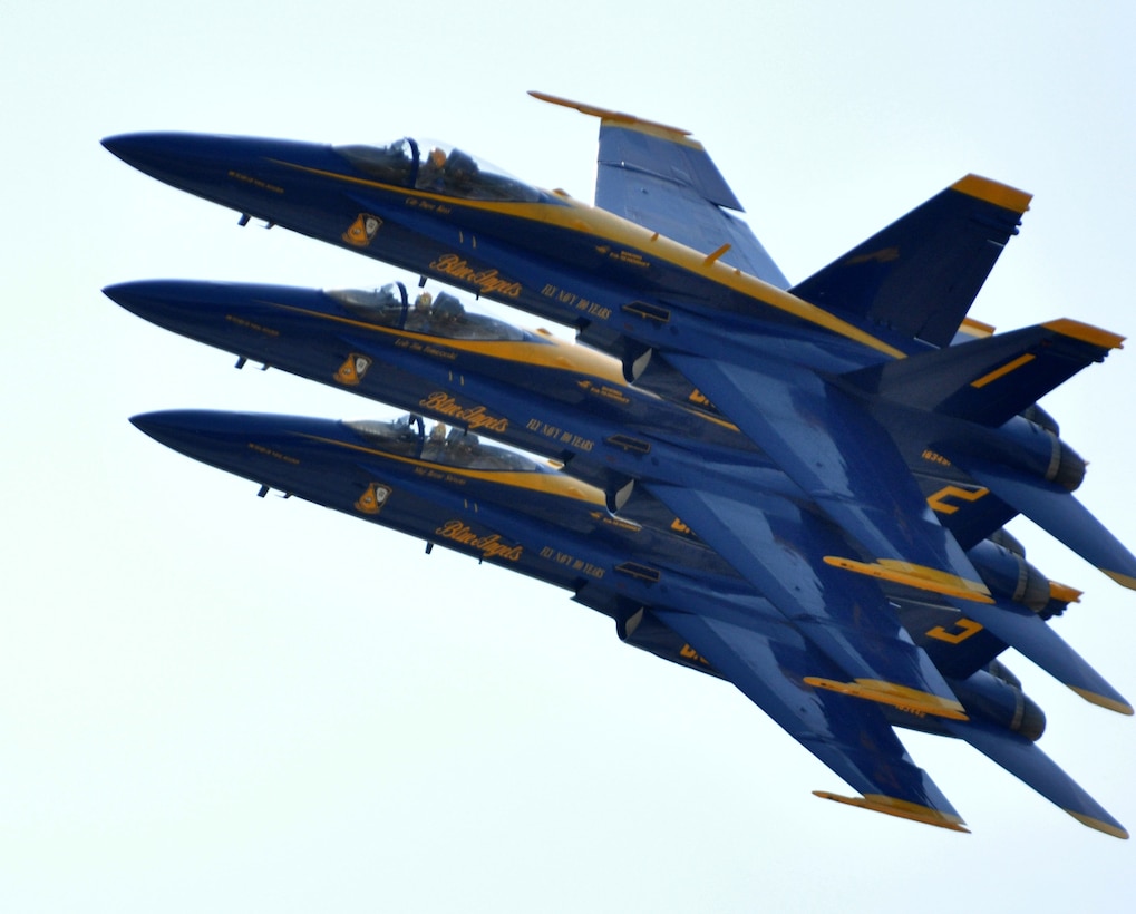 Three of the U.S. Navy's Blue Angels flight-demonstration team fly over the 2011 Air Power Expo in an echelon formation, April 17, at Naval Air Station Fort Worth Joint Reserve Base, Texas.  (U.S. Air Force photo/Lt. Col. David Kurle)
