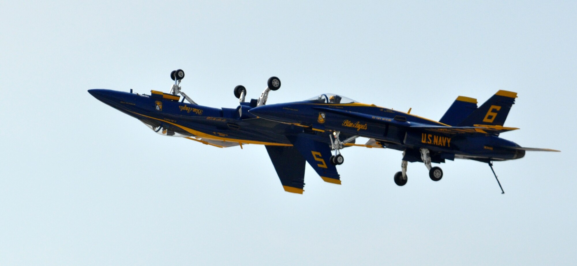 Blue Angels pilots Navy Lts. Ben Walborn and C.J. Simonsen perform a "mirror image" fly-by April 17 during the 2011 Air Power Expo at Naval Air Station Fort Worth Joint Reserve Base, Texas.  (U.S. Air Force photo/Lt. Col. David Kurle) 