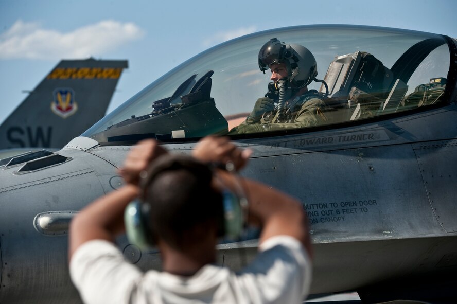 Capt. Jeremy Nolting, 79th Fighter Squadron pilot, awaits clearance from the tower to taxi his F-16 Fighting Falcon out for a training mission during exercise Green Flag West at Nellis Air Force Base, Nev., April 20, 2011. (U.S. Air Force photo by Tech. Sgt. Michael R. Holzworth) 
