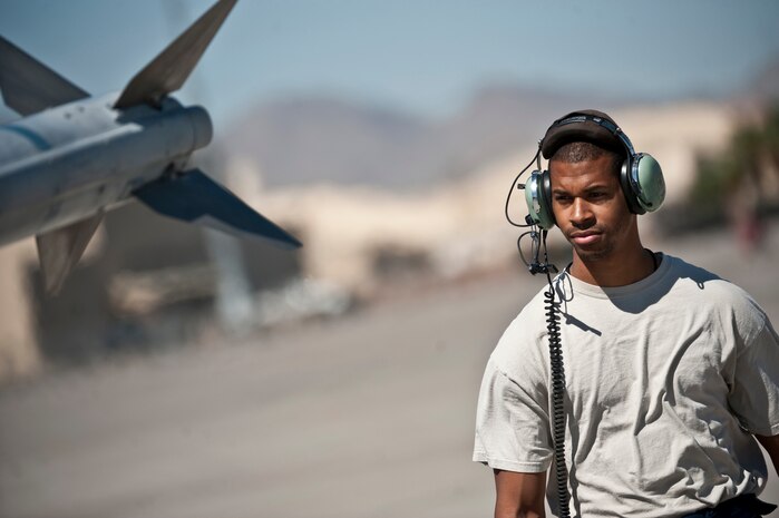 NELLIS AIR FORCE BASE, Nev. -- Senior Airman Eric McEwen, a crew chief from the 20th Aircraft Maintenance Squadron, Shaw Air Force Base, S.C.,  conducts pre-flight check on a 79th Fighter Squadron F-16 Fighting Falcon for a training mission during exercise Green Flag West 11-6, April 20. Green Flag West replicates irregular warfare conditions currently found in Southwest Asia. Aircrews, work closely with Air Force joint terminal attack controllers. Pilots train for a missions such as close air support, and aerial reconnaissance. (U.S. Air Force photo by Tech. Sgt. Michael R. Holzworth)