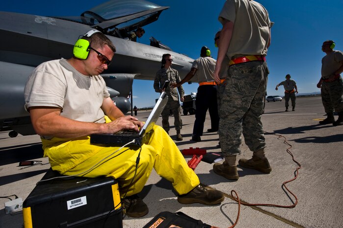 NELLIS AIR FORCE BASE, Nev. --  Bryan Waldon, a crew chief from the 20th Aircraft Maintenance Squadron, Shaw Air Force Base, S.C., looks over a electronic technical order for a F-16 Fighting Falcon during Green Flag West 11-6, April 20. Green Flag West replicates irregular warfare conditions currently found in Southwest Asia. Aircrews, work closely with Air Force joint terminal attack controllers. Pilots train for a mission such as close air support, and aerial reconnaissance. (U.S. Air Force photo by Senior Airman Brett Clashman)