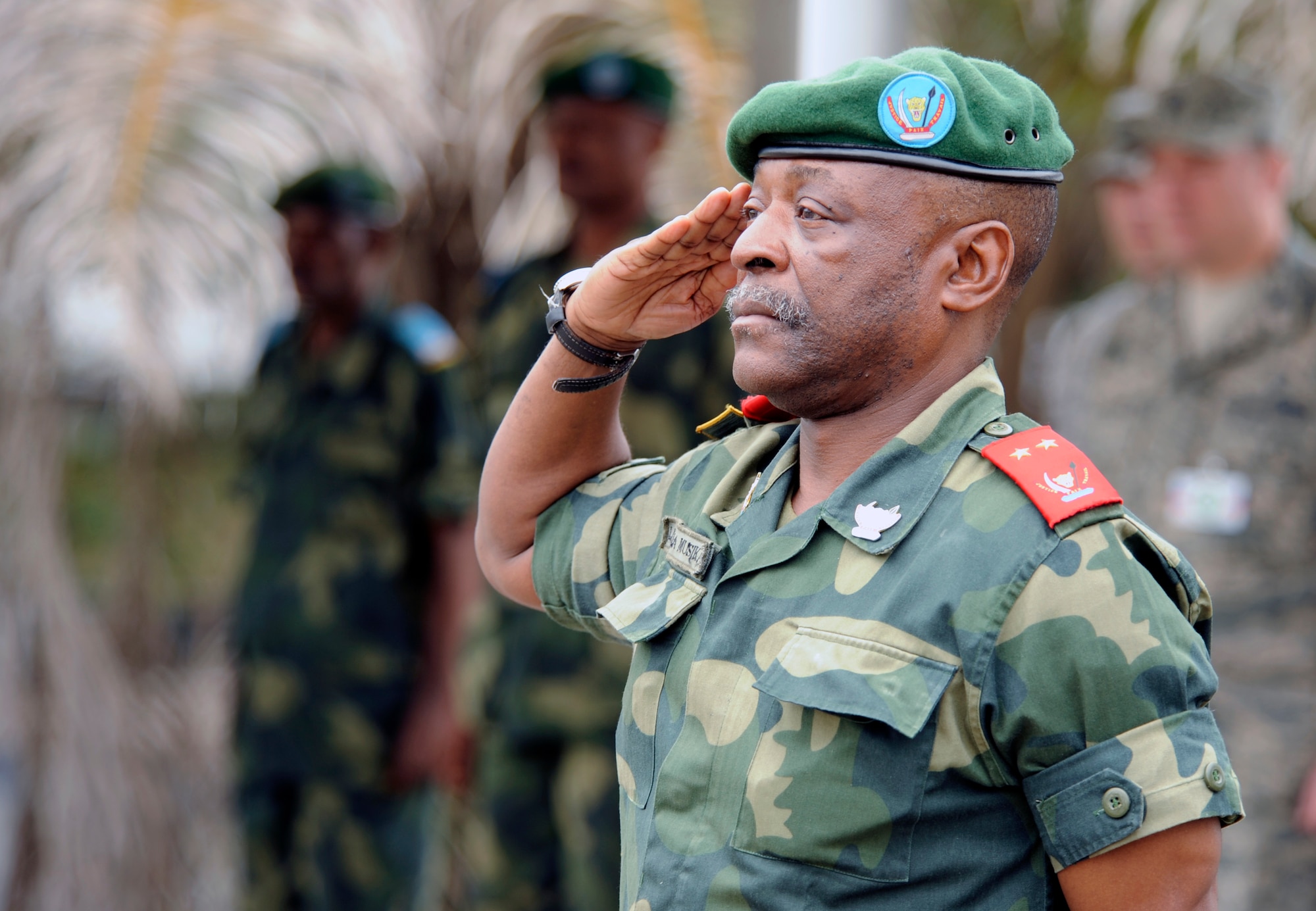 KINSHASA, Democratic Republic of the Congo ? Congolese Maj. Gen. Marcellin Lukama Musikami, salutes members of the Democratic Republic of the Congo military police force before the opening ceremonies for the MEDLITE 11 exercise, April 25, 2011. MEDLITE 11 is a joint medical exercise focused on aeromedical evacuation, to improve the readiness of U.S. Air Force and DRC personnel. (U.S. Air Force photo by Tech. Sgt. Todd Wivell)


