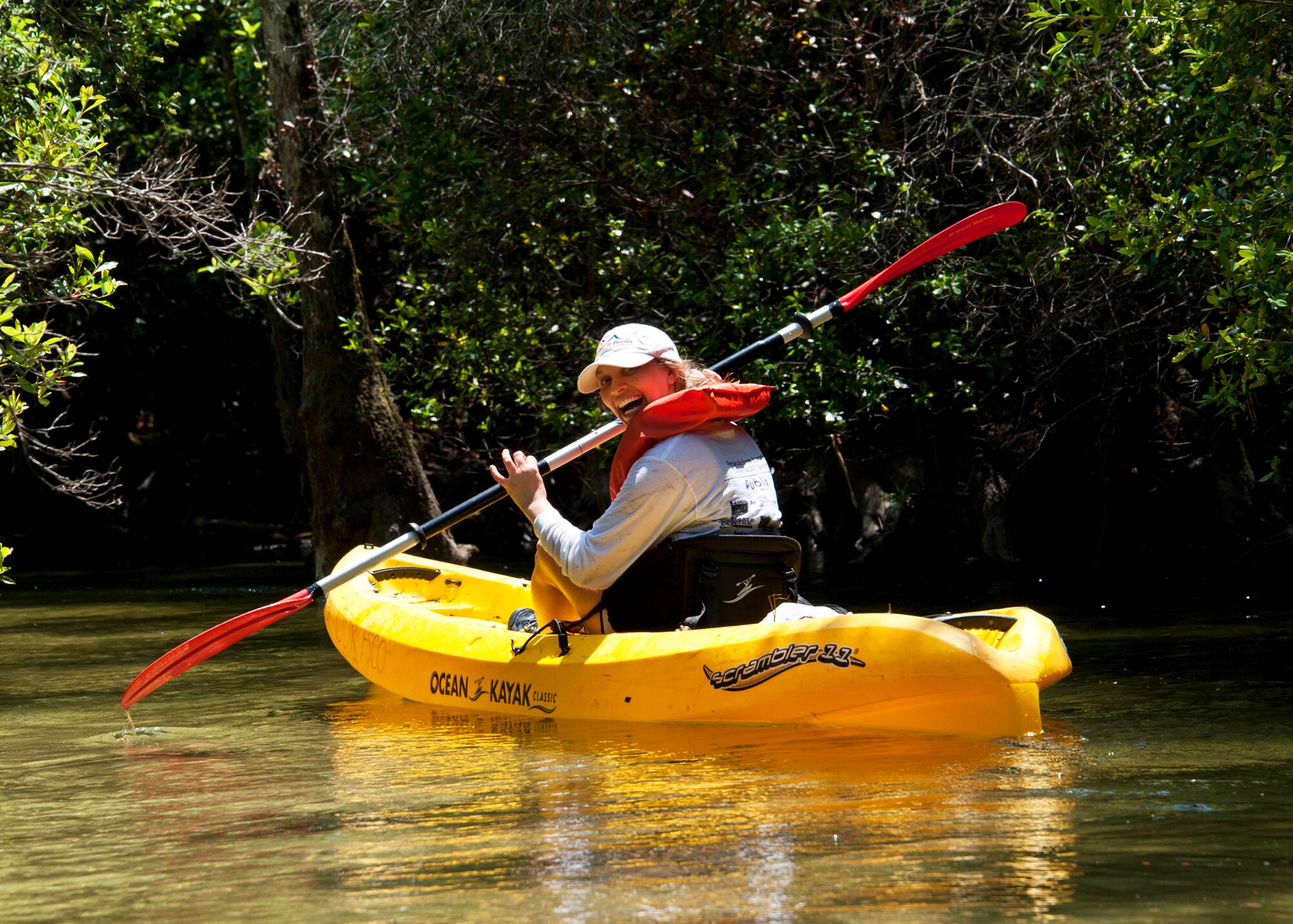 Angel McCurdy “checks her six” as she paddles down Turkey Creek April 21.  The second annual kayak tour, part of four days of trips, took 10 people down Turkey Creek deep within the Eglin range. The scenic tour showed off Eglin’s unique wild and plant life. The tour closed out Eglin’s week-long Earth Day celebration. The kayaks were donated by Eglin's Outdoor Recreation for each day of the trip. (U.S. Air Force photo/Samuel King Jr.)

