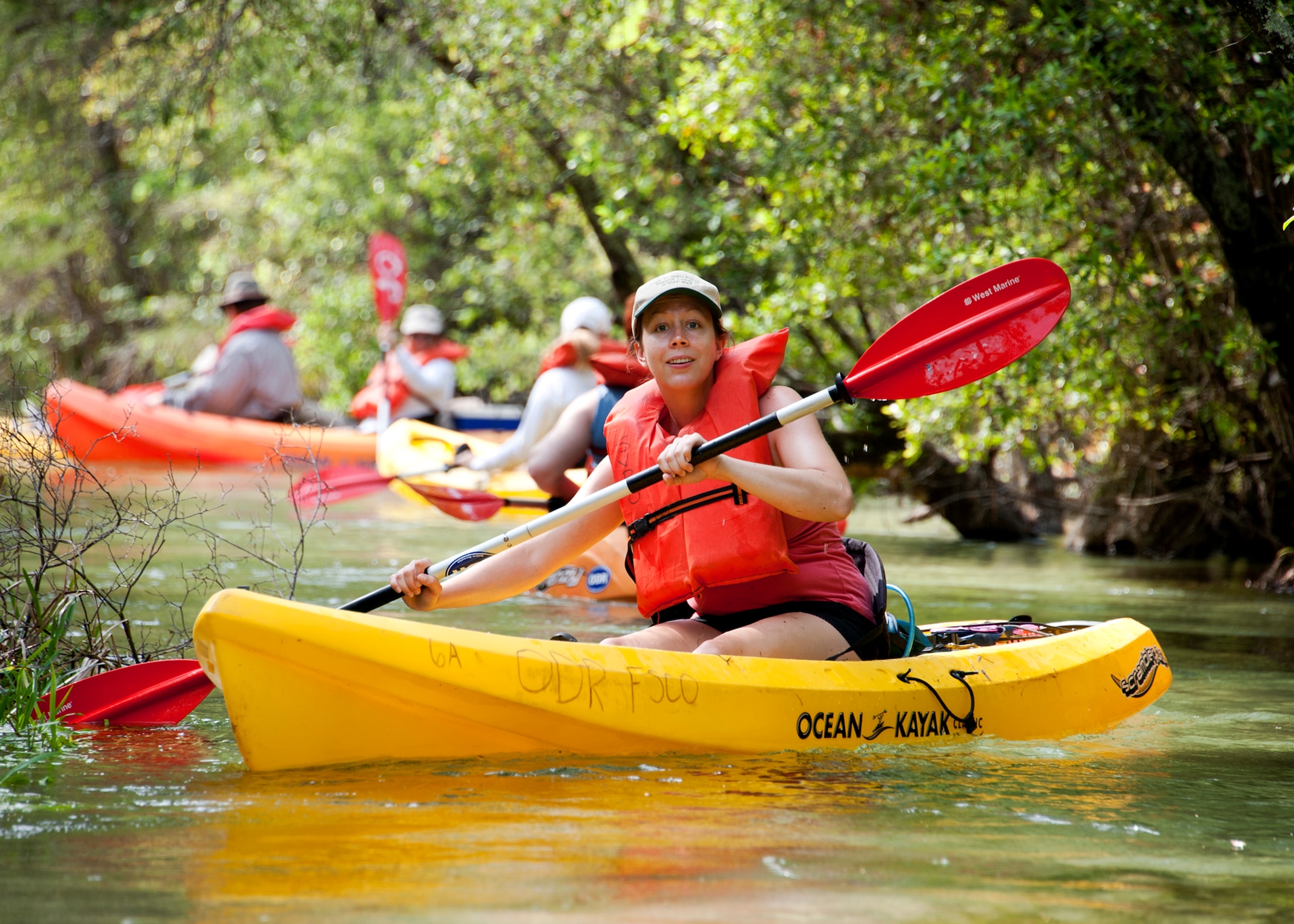 Amanda Briant, 96th Civil Engineer Squadron, keeps the kayakers together during their tour down Turkey Creek April 21. The second annual kayak tour, part of four days of trips, took 10 people down Turkey Creek deep within the Eglin range. The scenic tour showed off Eglin’s unique wild and plant life. The tour closed out Eglin’s week-long Earth Day celebration. The kayaks were donated by Eglin's Outdoor Recreation for each day of the trip. (U.S. Air Force photo/Samuel King Jr.)
