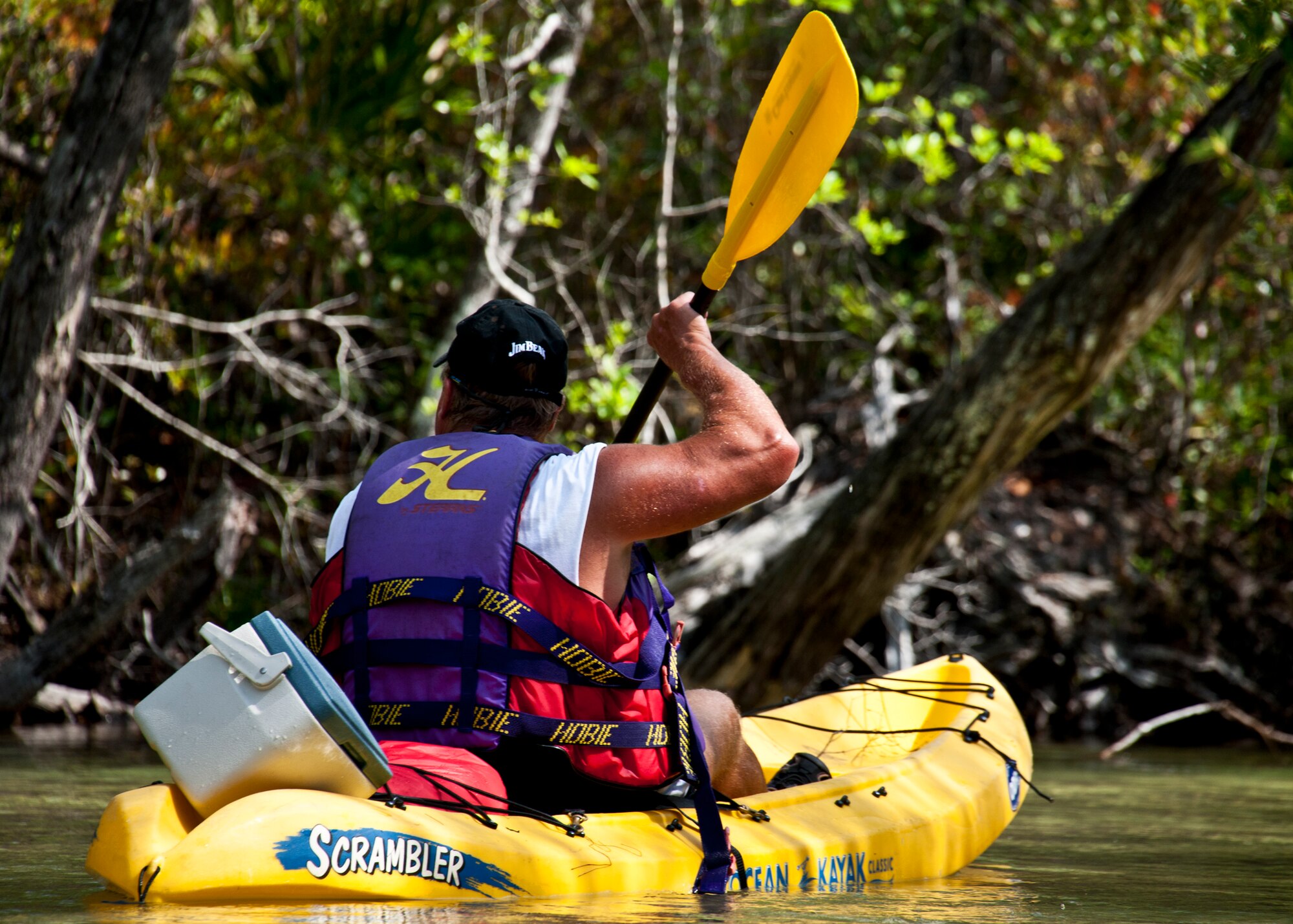 Mark Westerlund, 96th Force Support Squadron, checks out the scenario as he paddles down Turkey Creek April 21.  The second annual kayak tour, part of four days of trips, took 10 people down Turkey Creek deep within the Eglin range. The scenic tour showed off Eglin’s unique wild and plant life. The tour closed out Eglin’s week-long Earth Day celebration. The kayaks were donated by Eglin's Outdoor Recreation for each day of the trip. (U.S. Air Force photo/Samuel King Jr.)
