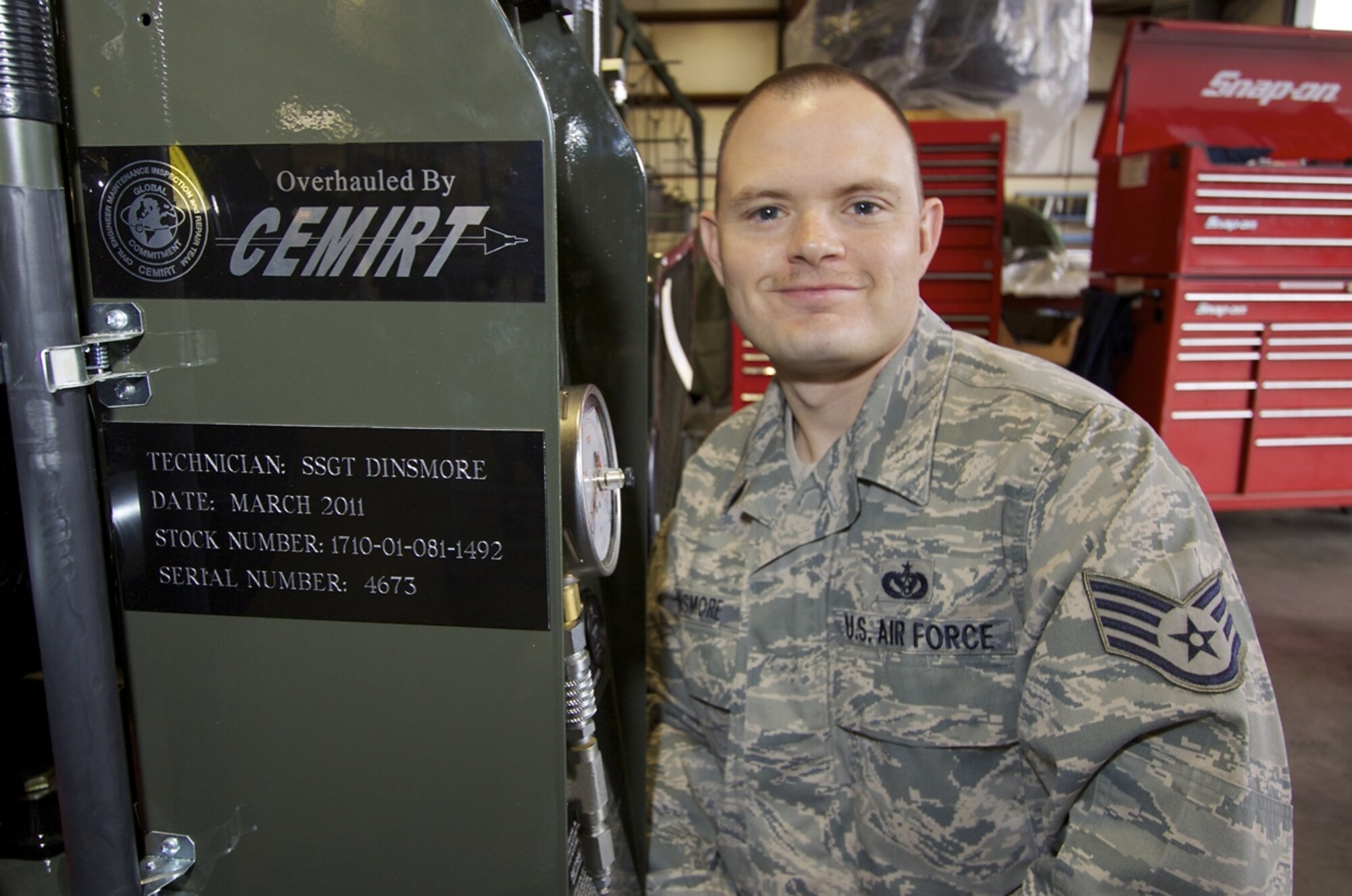 Staff Sgt. Daniel Dinsmore, an Industrial Power Generation Mechanic with the Civil Engineer Maintenance, Inspection and Repair Team, poses next to placard with his name on a BAK-12 absorber that he recently rebuilt at CEMIRT’s Tyndall AFB, Fla. operation. (U.S. Air Force photo/Eddie Green)