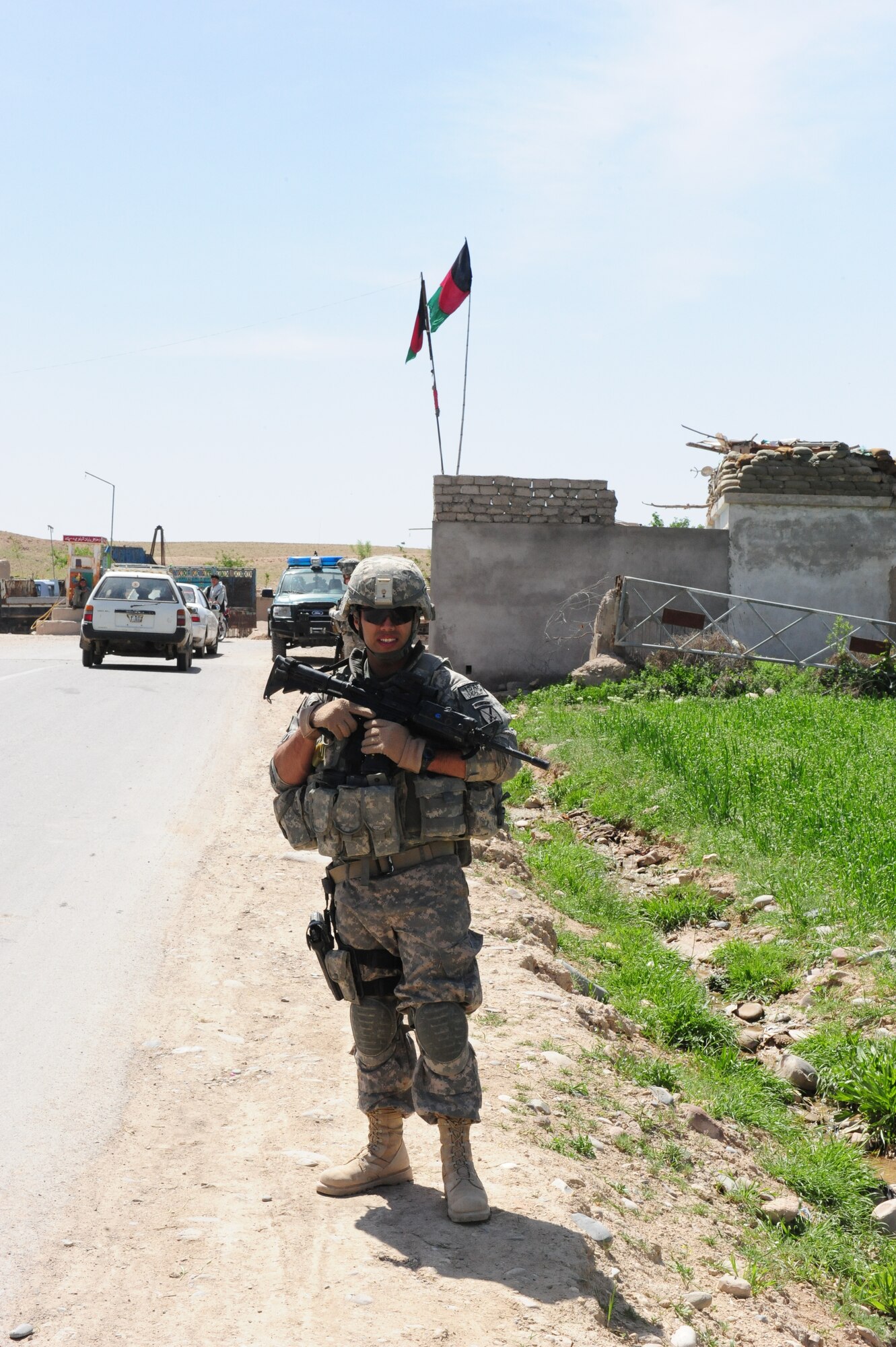 URUZGAN PROVINCE, Afghanistan – Staff Sgt. Carlos Martinez, Provincial Reconstruction Team Uruzgan Supply noncommissioned officer, provides security during a civil affairs mission near the village of Sar Sheykill, April 21.  Although a logistics specialist by trade, Sergeant Martinez is trained in areas such as security – acting as a force multiplier for the PRT on a variety of outside the wire missions.  Sergeant Martinez is deployed to PRT Uruzgan from the 366th Logistics Readiness Squadron “Gunfighters” from Mountain Home Air Force Base, Idaho.  (U.S. Air Force photo/1st Lt. Matt Schroff)