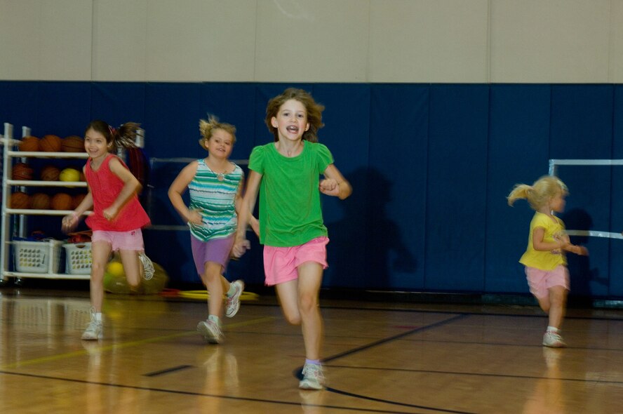 Children in the Luke home school program run across the gym during the physical education program at Luke Air Force Base, Ariz., April 19, 2011. This was one of the final exercises of the P.E. Class. (U.S Air Force Photo/Staff Sgt. Jason Colbert)