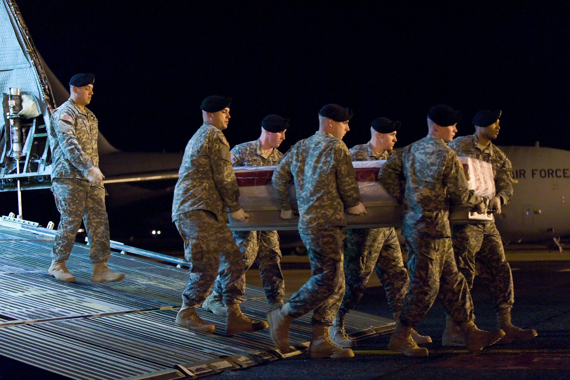 A U.S. Army carry team transfers the remains of Army Pfc. Antonio G. Stiggins, of Rio Rancho, N.M., at Dover Air Force Base, Del., April 25, 2011. Stiggins was assigned to the 2nd Squadron, 3rd Armored Cavalry Regiment, Fort Hood, Texas. (U.S. Air Force photo/Roland Balik)