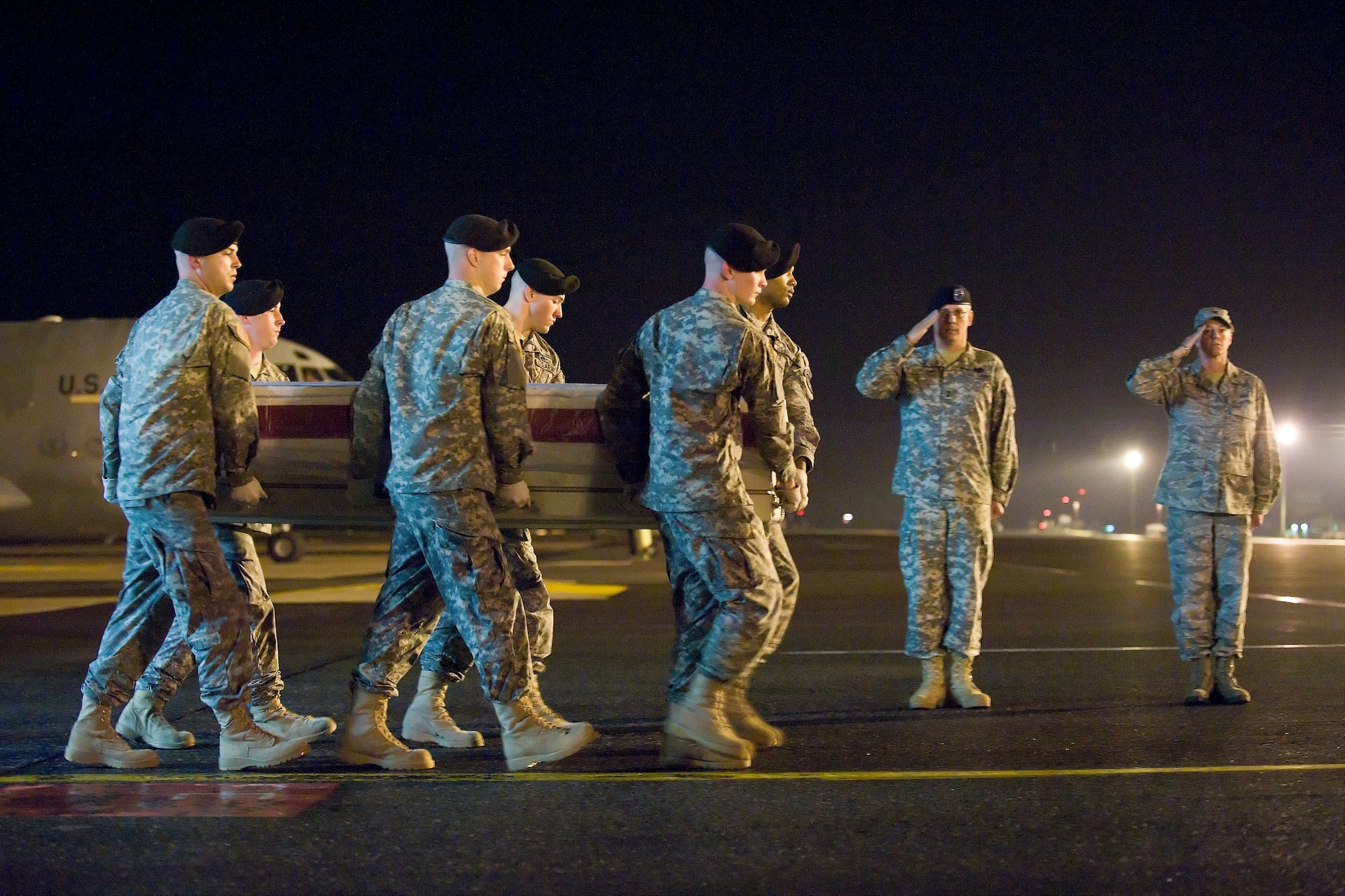 A U.S. Army carry team transfers the remains of Army 1st Lt. Omar J. Vazquez, of Hamilton, N.J., at Dover Air Force Base, Del., April 25, 2011. Vazquez was assigned to the 2nd Squadron, 3rd Armored Cavalry Regiment, Fort Hood, Texas. (U.S. Air Force photo/Roland Balik)