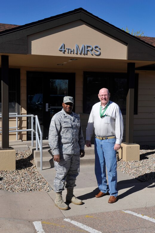Lt. Col. Ernest Wearren, 4th Manpower Requirements Squadron commander, and Ed Makepeace, 4th MRS deputy director, outside their new home, Building 391, on Peterson Air Force Base. The 4th MRS, which stood up in 2006, had been temporarily located at Buckley Air Force Base in Denver. The 21st Civil Engineer Squadron worked through the winter months to transform the 9,325-square-foot facility, which was built in 1951, for the 4th MRS. The squadron is one of more than 50 mission partners operating on Peterson AFB. (U.S. Air Force photo/Robb Lingley)