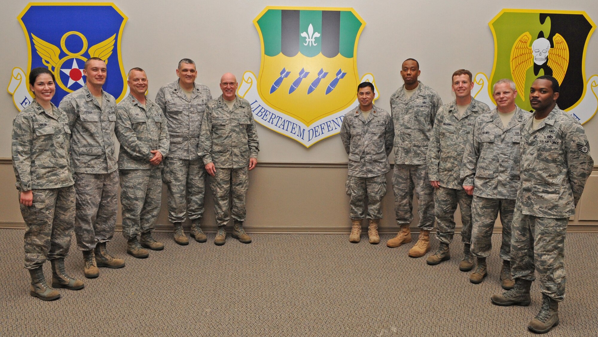 Chief of Air Force Chaplains Maj. Gen. Cecil Richardson (fifth from the left) poses with the base chapel staff after the National Prayer Luncheon on Barksdale Air Force Base, La., April 20. The Barksdale Chapel offers many services to Airmen and their families. To find out more information about services offered, contact the base chapel at 456-2111 or 456-2466. (U.S. Air Force photo/Airman 1st Class Micaiah Anthony)(RELEASED) 