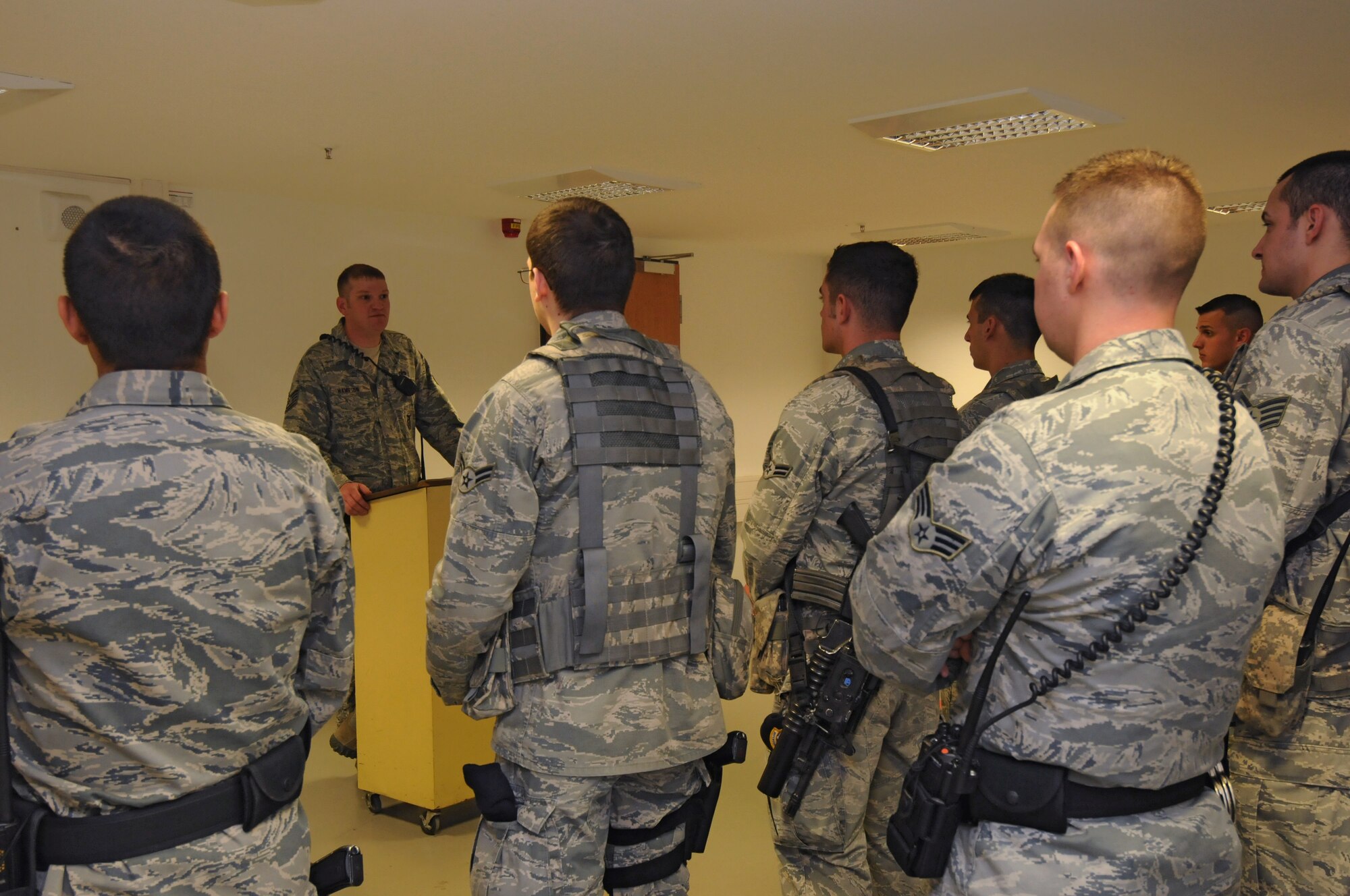 SPANGDAHLEM AIR BASE, Germany -- Tech. Sgt. Nick Hampton, 52nd Security Forces Squadron flight chief, briefs his flight during guard mount here April 21. Guard mount allows an opportunity for a flight chief to brief his Airmen about important squadron topics and the upcoming shift. (U.S. Air Force photo/Staff Sgt. Benjamin Wilson)