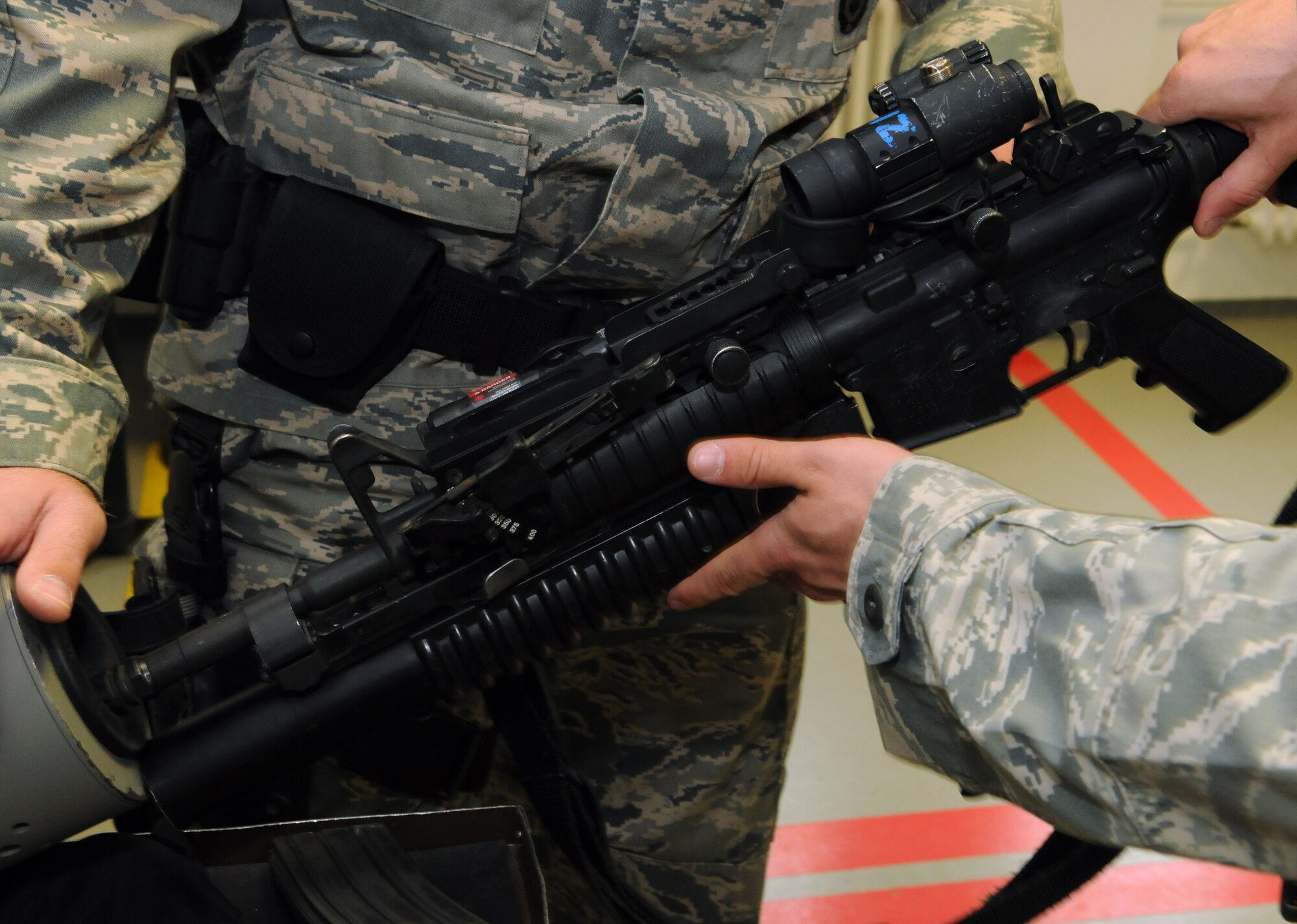 SPANGDAHLEM AIR BASE, Germany – A 52nd Security Forces Squadron Airman clears the barrel of his weapon before receiving his briefing prior to guard mount here April 21. Guard mount allows an opportunity for a flight chief to brief his Airmen about important squadron topics and the upcoming shift. (U.S. Air Force photo/Staff Sgt. Benjamin Wilson)