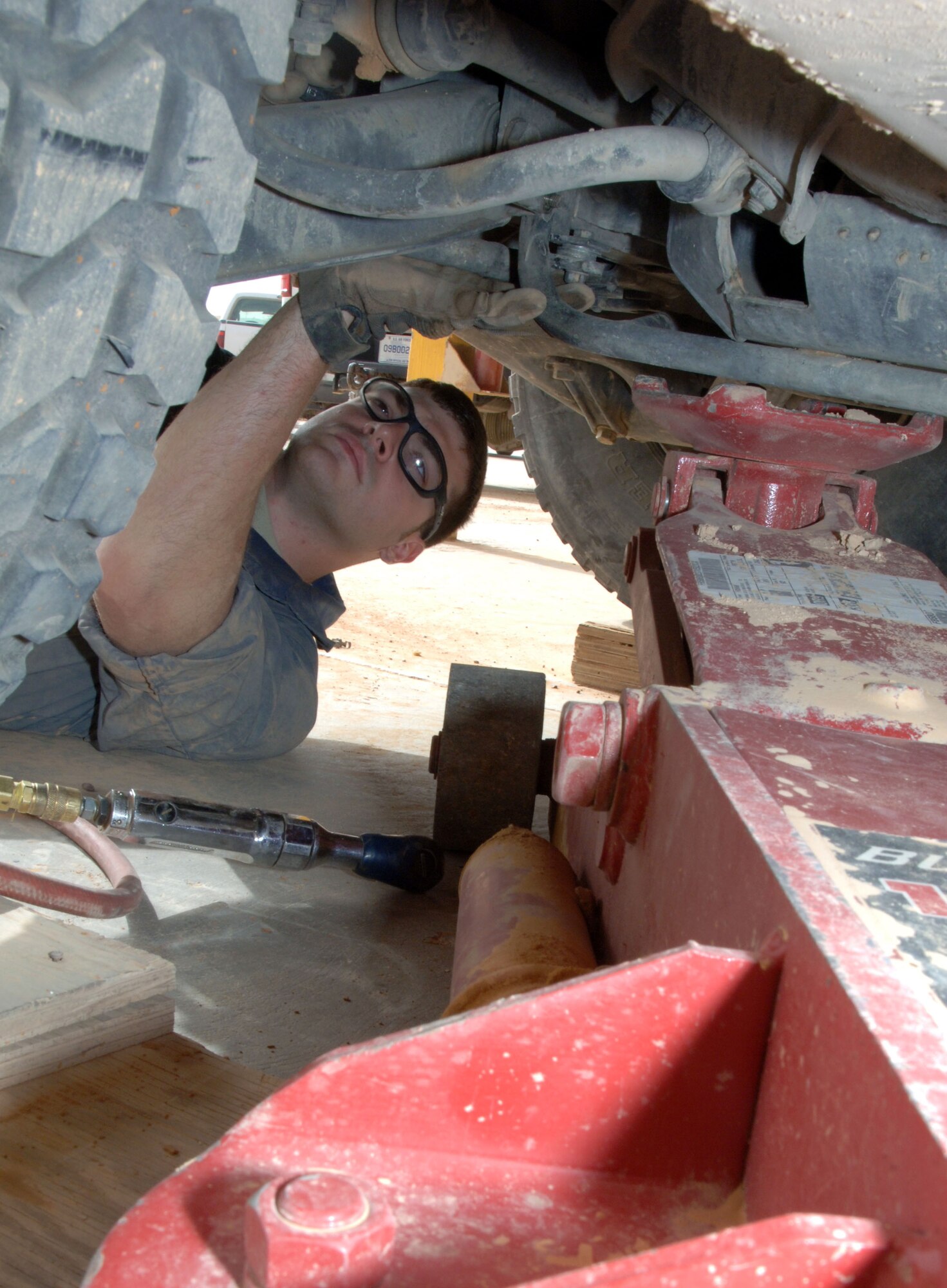 Staff Sgt. Chris Stamm, 532nd Expeditionary Operation Support Squadron Vehicle Maintenance Element mechanic and Canton, Ohio, native, removes a starter from a humvee April 18, 2011, at Al Asad Air Base, Iraq. The vehicle maintenance element is responsible for maintaining a 68 vehicle fleet worth more than $18 million. Sergeant Stamm is deployed from Ramstein Air Base, Germany. (U.S. Air Force photo by Staff Sgt. R. Michael Longoria/Released)