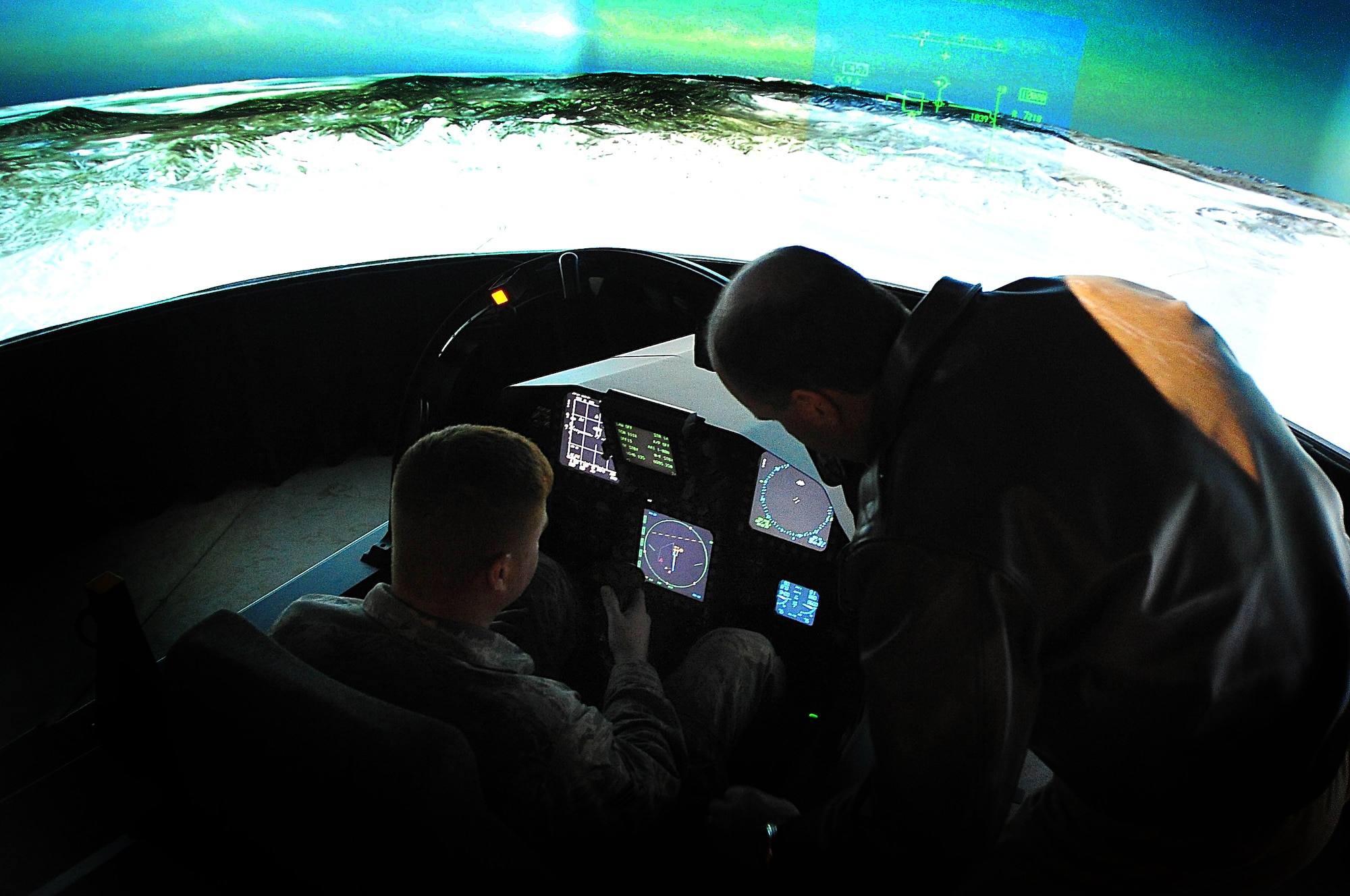 Boeing made available a F-15K simulator with 180 degree display to Osan Air base, Republic of Korea, personnel , April 25. Loaded with realistic scenarios, the simulator gave a real feel to the operator enabling Airmen to hop in the cockpit and take out enemy aircraft as well as bomb labeled facilities. The F-15 was armed with two laser guided missiles and one bomb for each mission.  After each mission Airmen rotated out and discussed amongst each other how difficult flying is. (U.S. Air Force Photo by/ Staff Sgt. Daylena Gonzalez)