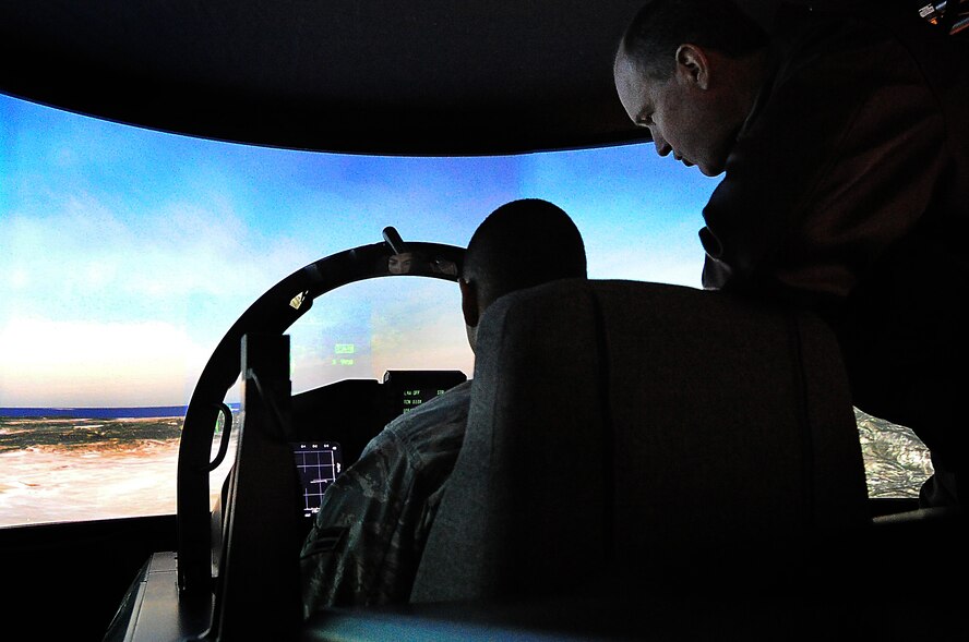 Boeing made available a F-15K simulator with 180 degree display to Osan Air base, Republic of Korea, personnel , April 25. Loaded with realistic scenarios, the simulator gave a real feel to the operator enabling Airmen to hop in the cockpit and take out enemy aircraft as well as bomb labeled facilities. The F-15 was armed with two laser guided missiles and one bomb for each mission.  After each mission Airmen rotated out and discussed amongst each other how difficult flying is. (U.S. Air Force Photo by/ Staff Sgt. Daylena Gonzalez)