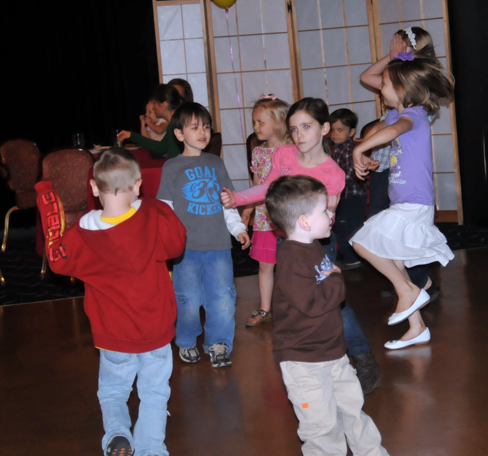 YOKOTA AIR BASE, Japan -- Kids dance at the "Shake your booty not your baby" event held at the enlisted club, Yokota Air Base, Japan, April 22, 2011. More than 100 people attended the 5th annual event focused on raising awareness of Shaken Baby Syndrome. (U.S. Air Force photo/Airman 1st Class Krystal M. Garrett)