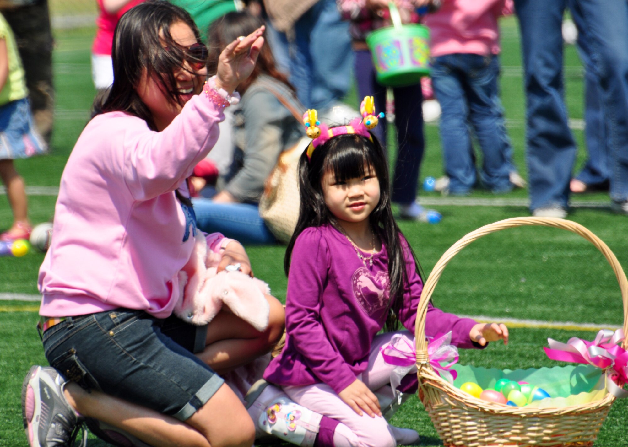 Osan celebrated Month of the Military Child and Child Abuse Prevention Month with a base parade and Easter egg hunt here April 23. About 200 people participated in the parade from the Officers' Club to the Osan High School football field. More than 10,000 plastic eggs were placed around the field for children to pick up during the Easter egg hunt. (U.S. Air Force photo/Staff Sgt. Chad Thompson)
