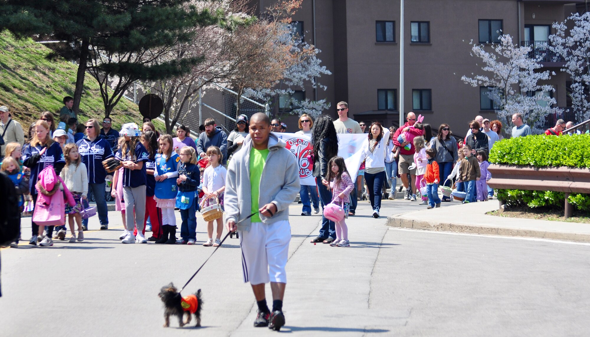 About 200 people walked in the parade from the Officers' Club to the Osan High School football field April 23. The parade was celebrating the Month of the Military Child and Child Abuse Prevention Month. (U.S. Air Force photo/Staff Sgt. Chad Thompson)