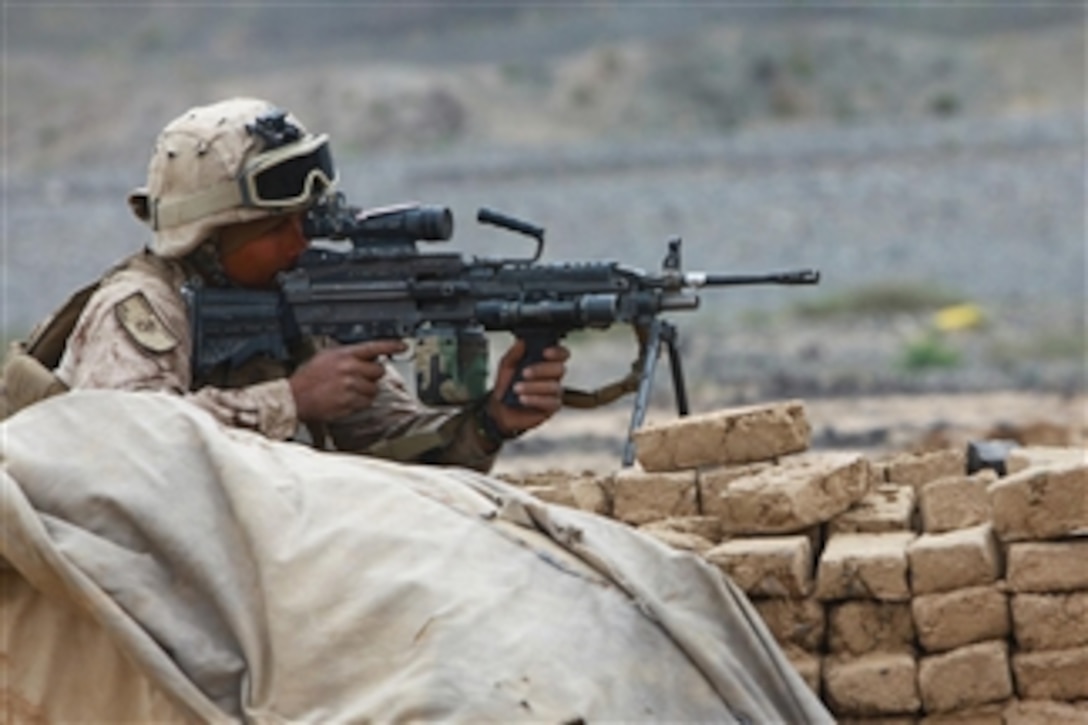 Lance Cpl. Nicholas W. Sainz, an assistant team leader in 1st Platoon, E Company, 3rd Light Armored Reconnaissance Battalion, provides security during operations in Helmand province on April 16, 2011.  Sainz stood watch while other Marines conducted a search.  