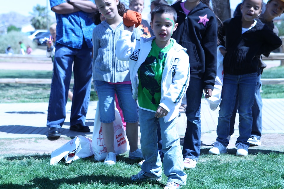 Manuel Laureano, 5-year-old son of Staff Sgt. Juan Laureano, an instructor at the Marine Corps Communication-Electronics School, demonstrates why he may one day be a star quarterback in the National Football League during the Military Child Carnival at Felix Field April 26, 2011.
