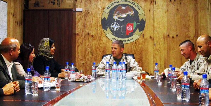 Col. Yori R. Escalante (middle), the assistant chief of staff C-9 for Regional Command Southwest, sits down for a meeting with Deputy Minister Suraya Paikan (front left), Ministry of Labor, Social Affairs, Martyrs and Disabled for the Islamic Republic of Afghanistan, aboard Camp Leatherneck, Afghanistan, April 26, 2011.  Escalante and other senior leaders informed Paikan of projects taking place in Helmand province and also talked about future plans for Southwestern Afghanistan.