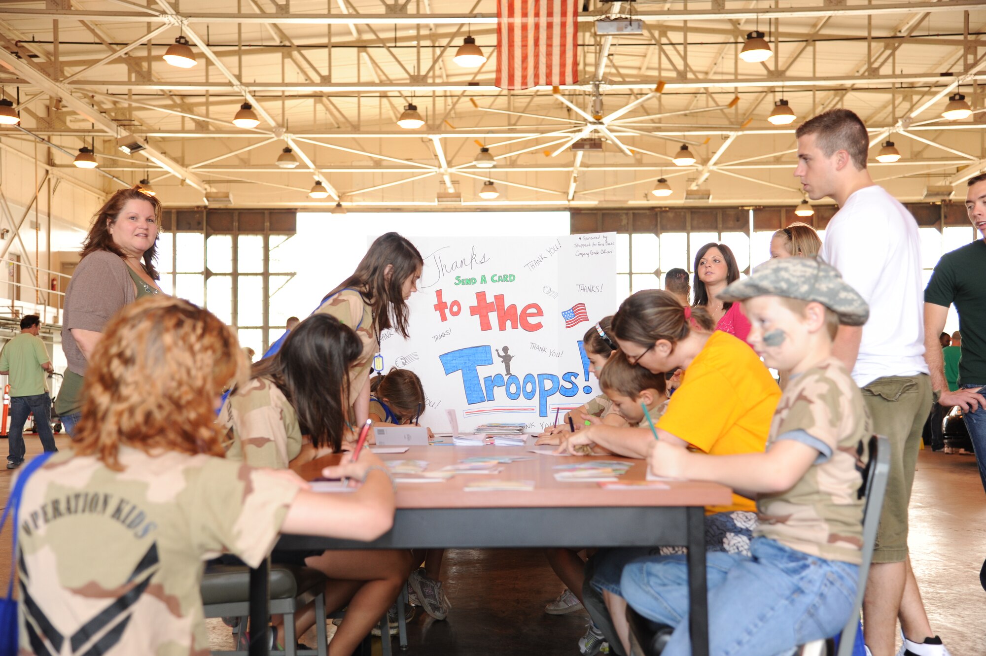 Young “troops” write letters and decorate cards during the annual Operation KIDS event, April 23, to support servicemembers who are deployed overseas. Operation KIDS helps introduce children in military families to the processes their parents go through during deployments. (U.S. Air Force Photo/Airman 1st Class Adawn Kelsey)