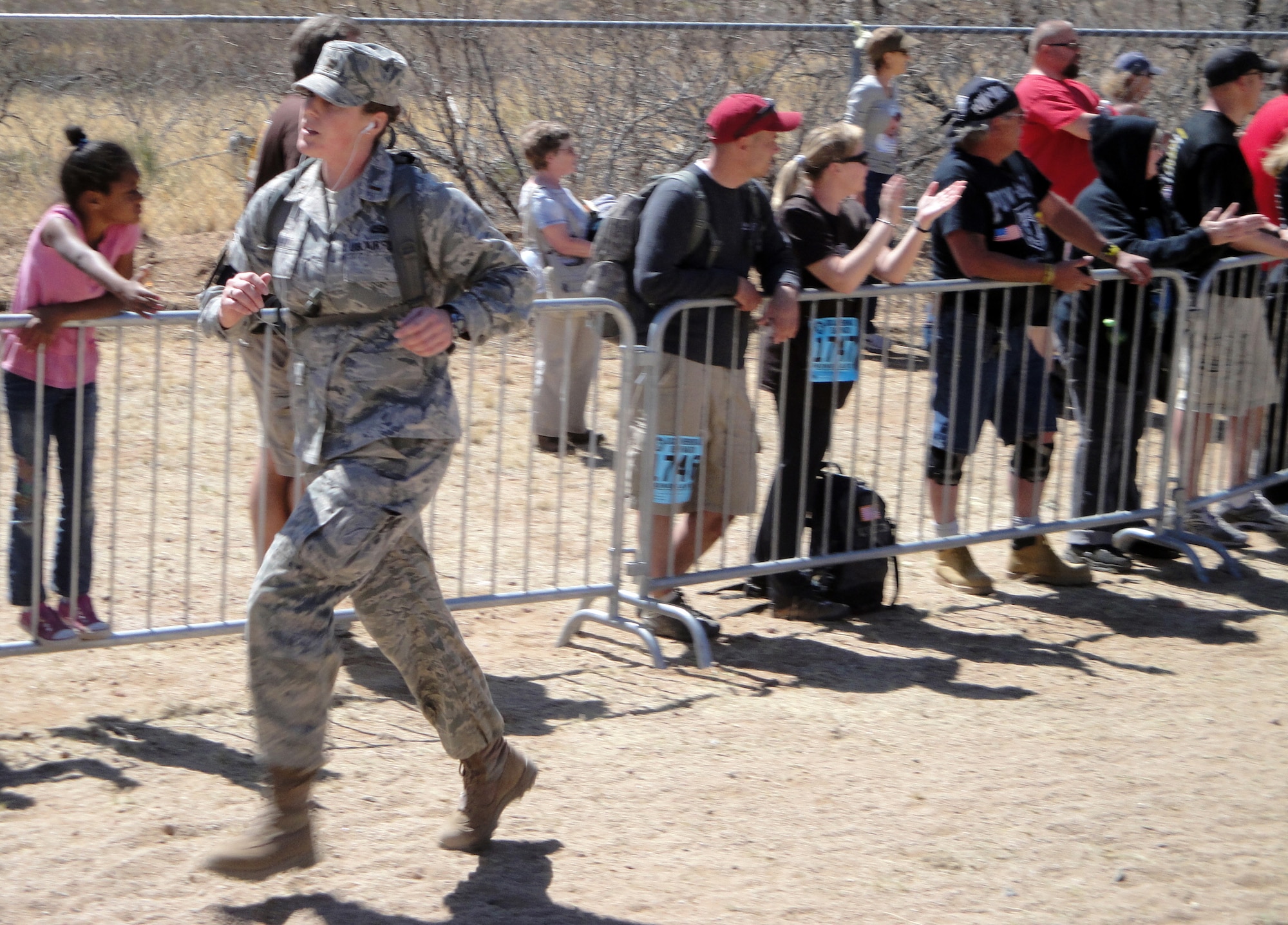 2nd Lt. Lindsay Krahn from the 354th Force Support Squadron paces herself during the 22nd Annual Bataan Death March held March 27, 2011, White Sands Missile Range, New Mexico.  Military participants were required to complete the 26.2 mile march in their respective combat uniforms with service authorized combat boots, and a hydration system.  (Courtesy Photo)