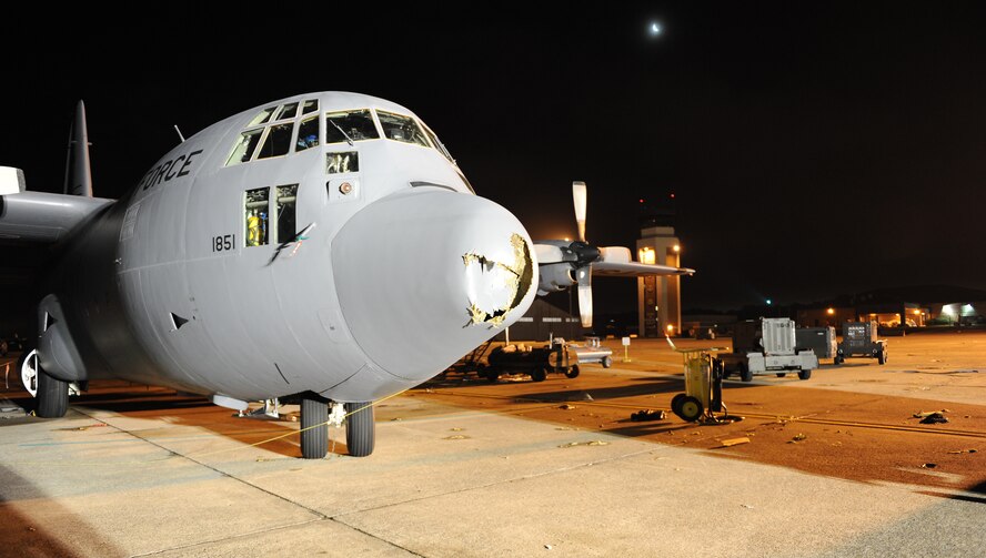 Damaged C-130 Hercules aircraft sit on the flightline April 26, 2011, at Little Rock Air Force Base, Ark., hours after a tornado struck at approximately 8 p.m. The tornado damaged three C-130 aircraft. In addition to aircraft damage, the base sustained significant damage to buildings along the flightline, the fire department and base housing. (U. S. Air Force photo by Airman 1st Class Ellora Stewart)