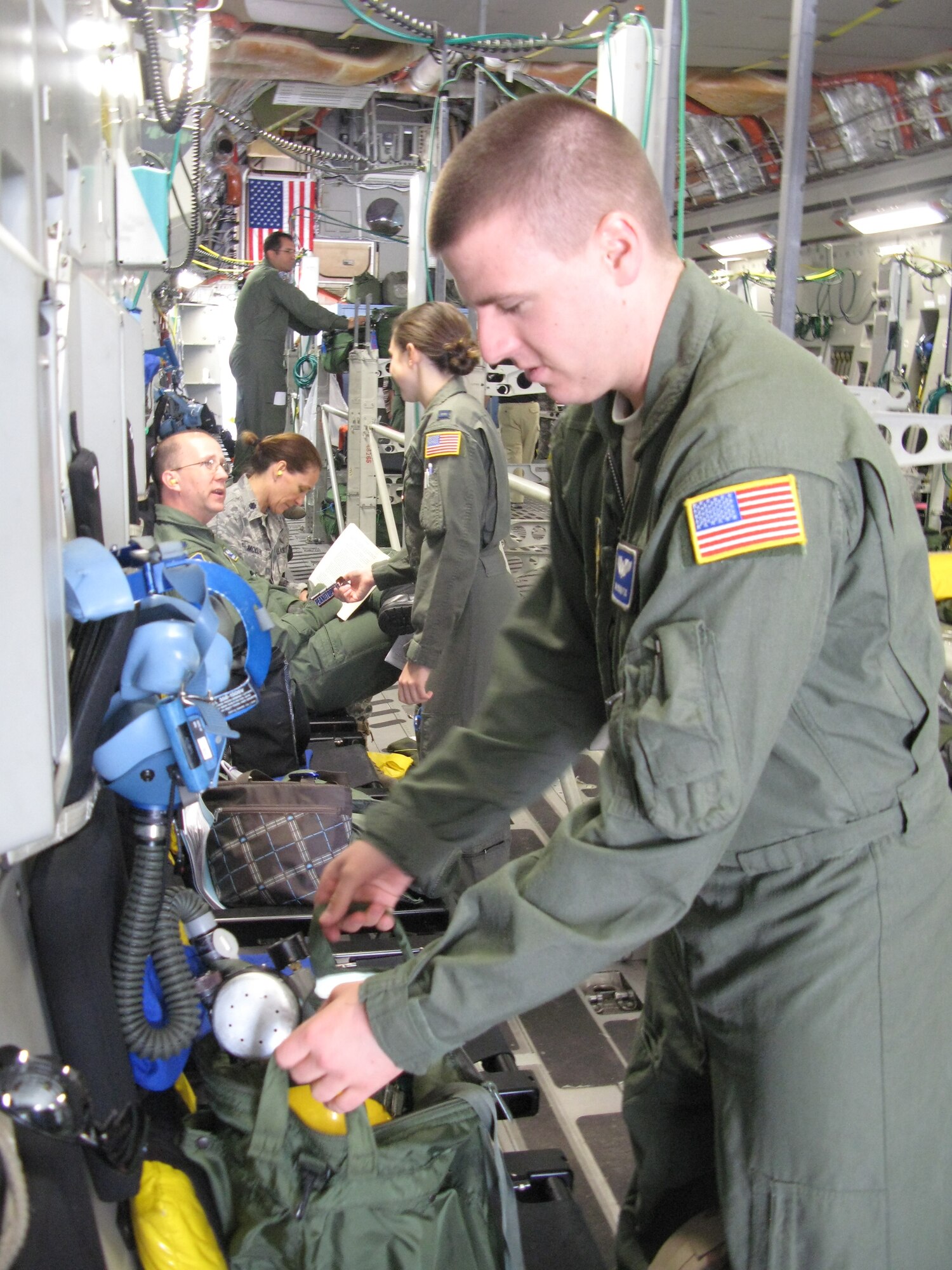 Senior Airman Brian Fox prepares ventilation equipment for an aeromedical evacuation flight from Ramstein Air Base, Germany, to Andrews Air Force, Md., April 26, 2011. (Defense Department photo/Donna Miles )