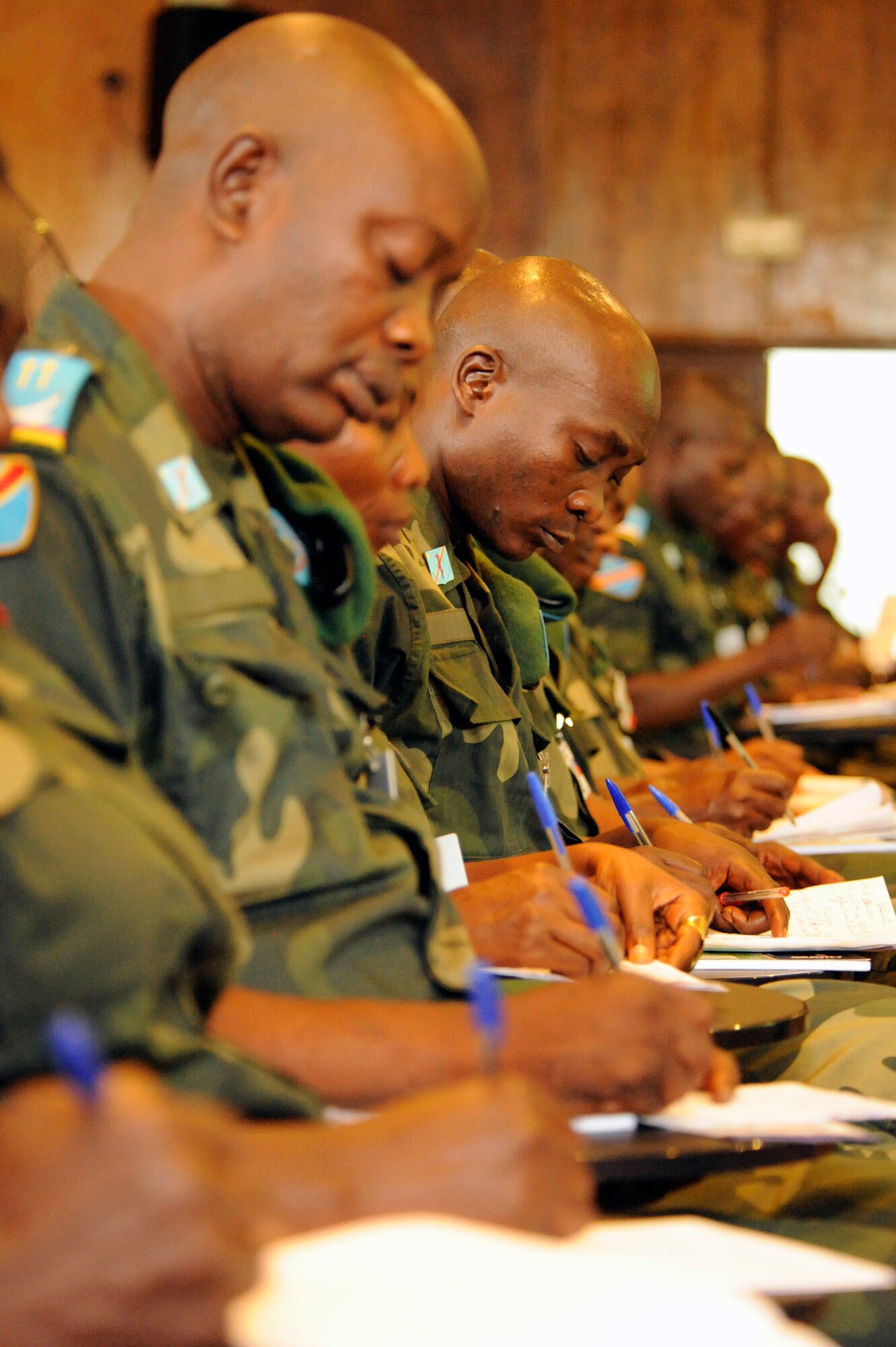 KINSHASA, Democratic Republic of the Congo ? Military members representing the Democratic Republic of the Congo take notes while attending an academic course during MEDLITE 11, April 26, 2011. MEDLITE 11 is a joint medical exercise focused on aeromedical evacuation, to improve the readiness of U.S. Air Force and DRC personnel. (U.S. Air Force photo by Tech. Sgt. Todd Wivell)
