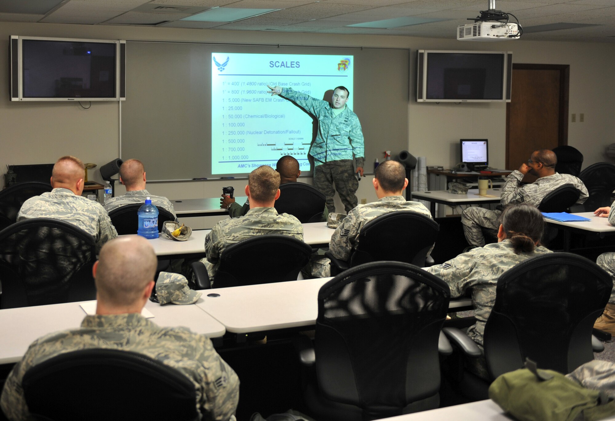 Senior Airman Jonathan Lach, 375th Civil Engineer Squadron readiness and emergency management, teaches a chemical, biological, radiological and nuclear training class April 26, 2011 at Scott Air Base, Ill.  CBRN training teaches Airmen the proper procedures to take while in contact with a contaminated substance. (U.S. Air Force photo/ Airman 1st Class Divine Cox)