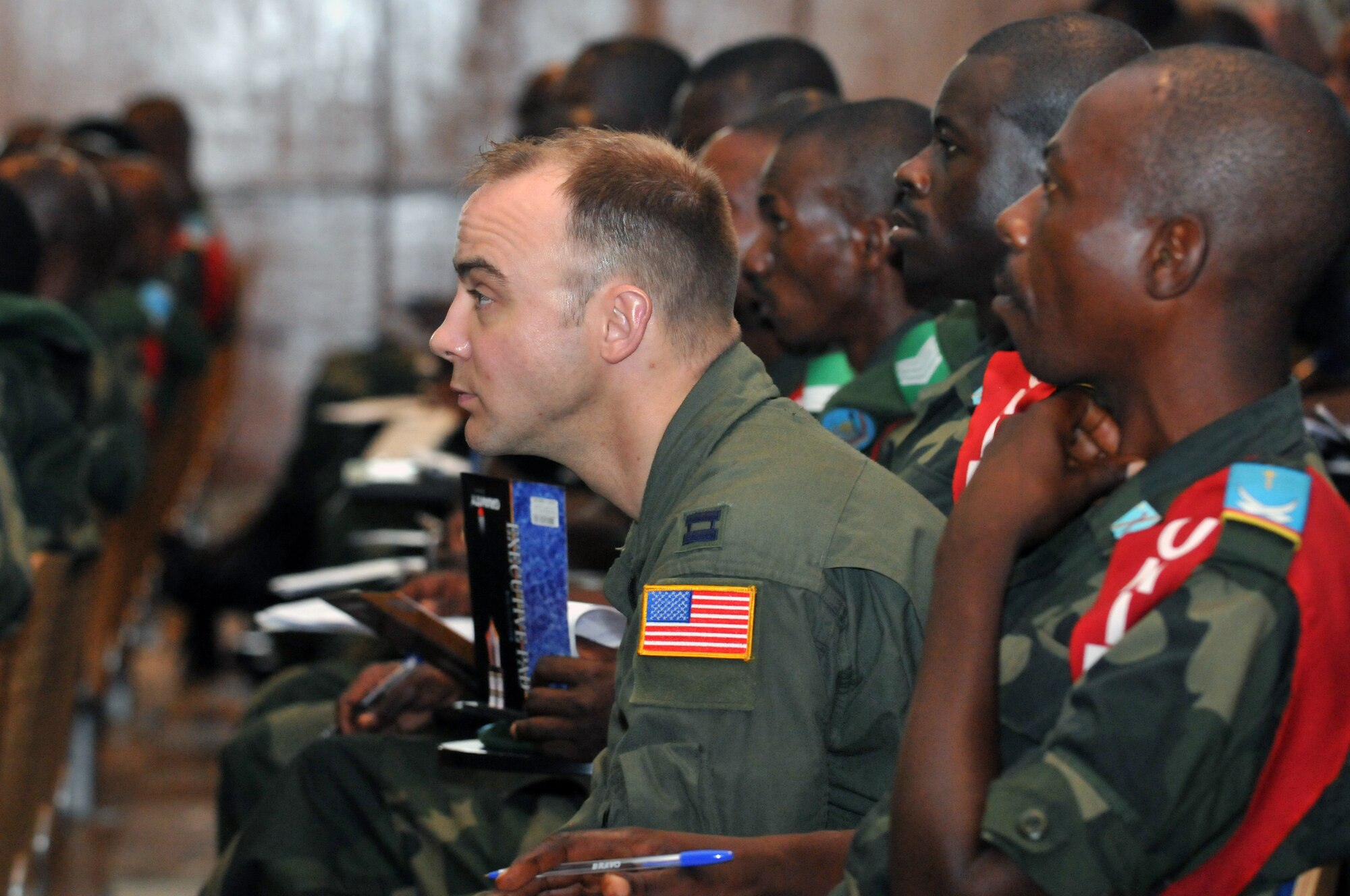 KINSHASA, Democratic Republic of the Congo -- U.S. Air Force Capt. Chris Wolf, a flight nurse with the Minnesota Air National Guard?s 133rd Airlift Wing listens to an academic lesson during MEDLITE 11, April 26, 2011. MEDLITE 11 is a joint medical exercise focused on aeromedical evacuation, to improve the readiness of U.S. Air Force and DRC personnel. (U.S. Air Force photo by Tech. Sgt. John Orrell)
