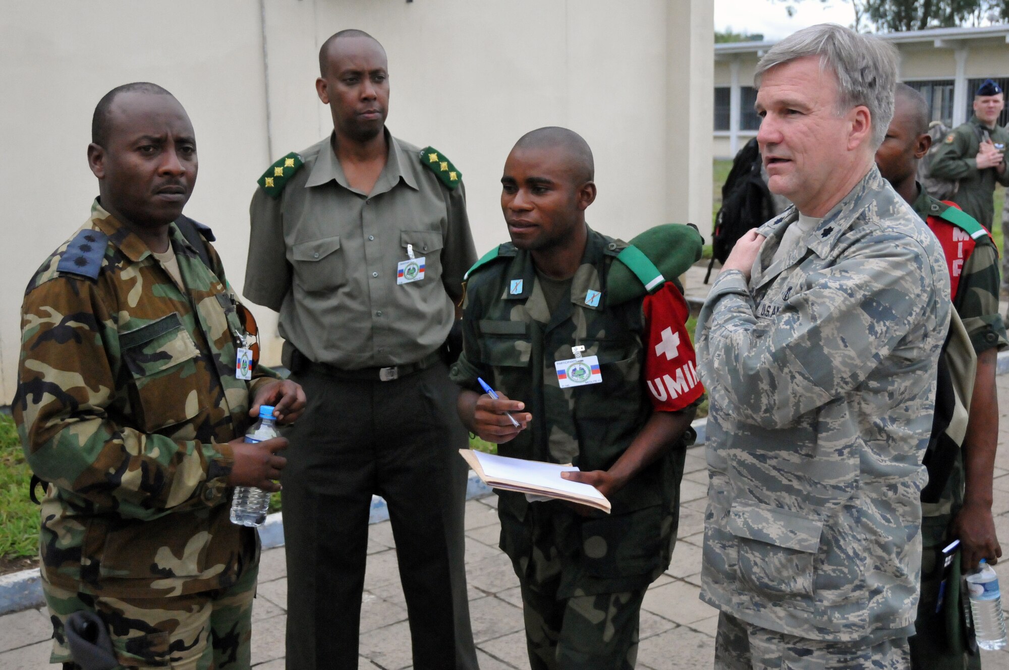 KINSHASA, Democratic Republic of the Congo -- U.S. Air Force Lt. Col. Mark Desjardins (right), a family practice doctor with the Rhode Island Air National Guard?s 143rd Airlift Wing, speaks with military members representing the Democratic Republic of the Congo and the Rwandan attendees of MEDLITE 11, April 26, 2011. MEDLITE 11 is a joint medical exercise focused on aeromedical evacuation, to improve the readiness of U.S. Air Force and DRC personnel. (U.S. Air Force photo by Tech. Sgt. John Orrell)
