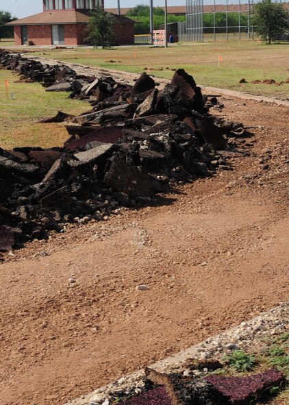 DYESS AIR FORCE BASE, Texas -- The track, football field and basketball court will be resurfaced and a 440-meter track will be built around the softball field for physical assessment training. Improvements to the track include a new rubberized and flat running surface to decrease injuries, the turf on the football field will be repaired and the basketball floor will be re-done. The project is estimated to take approximately 120 days to complete and cost approximately $1 million. 