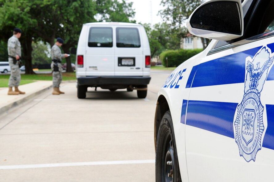 Staff Sgt. Robert O’Neill performs on-the-job-training with his partner, Airman 1st Class Randall Farmer during a traffic stop on Barksdale Air Force Base, La., April 26. Law enforcement patrol officers from 2 SFS are on the look-out for traffic violations including speeding and individuals who run stop signs while patrolling the installation. LE units are also dispatched to domestic disputes, shoplifting incidents, dorm fights and other instances where police presence is warranted. (U.S. Air Force photo/Senior Airman Joanna M. Kresge)